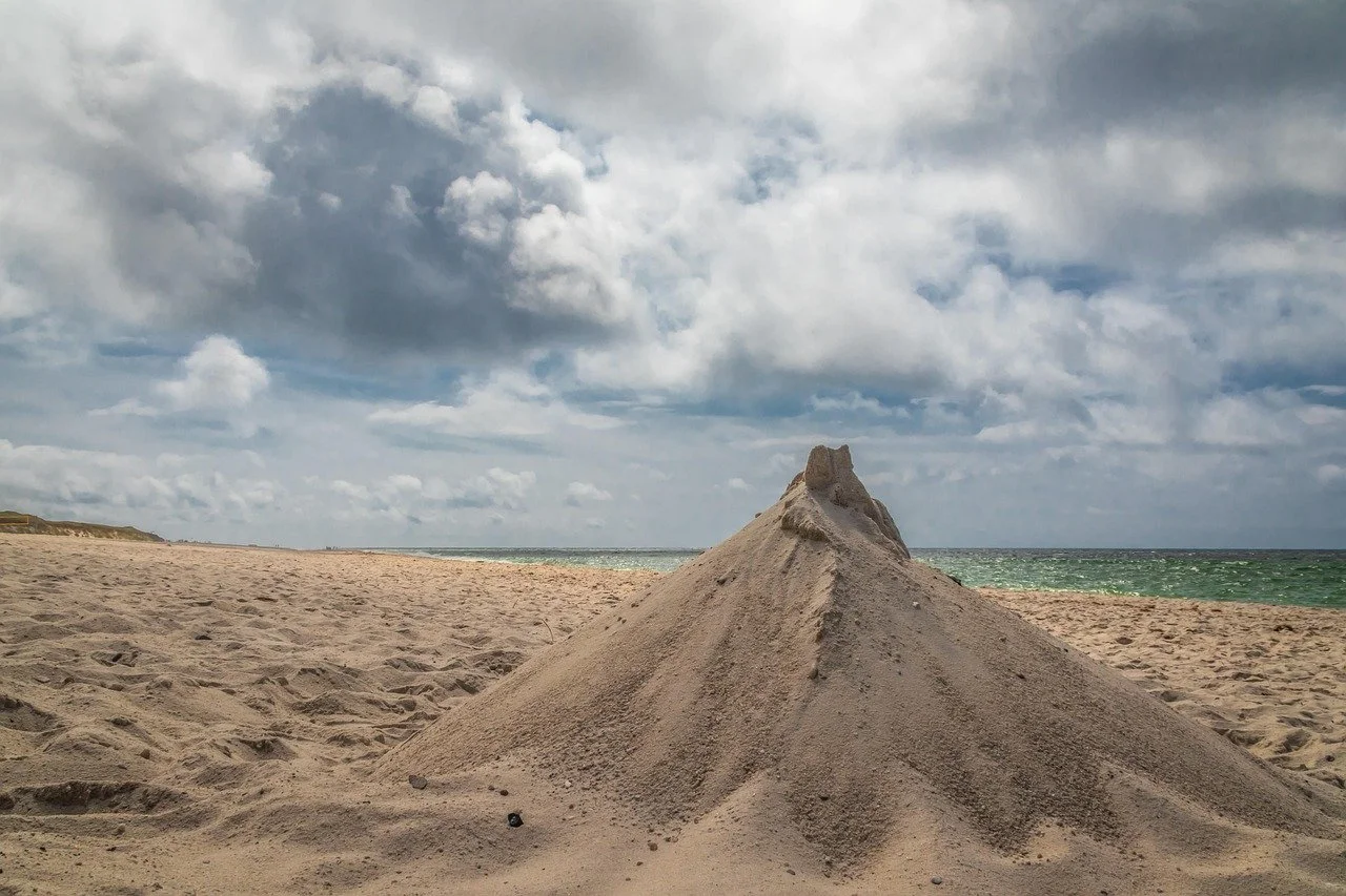 Sand hill outside by the water - goal setting after burnout