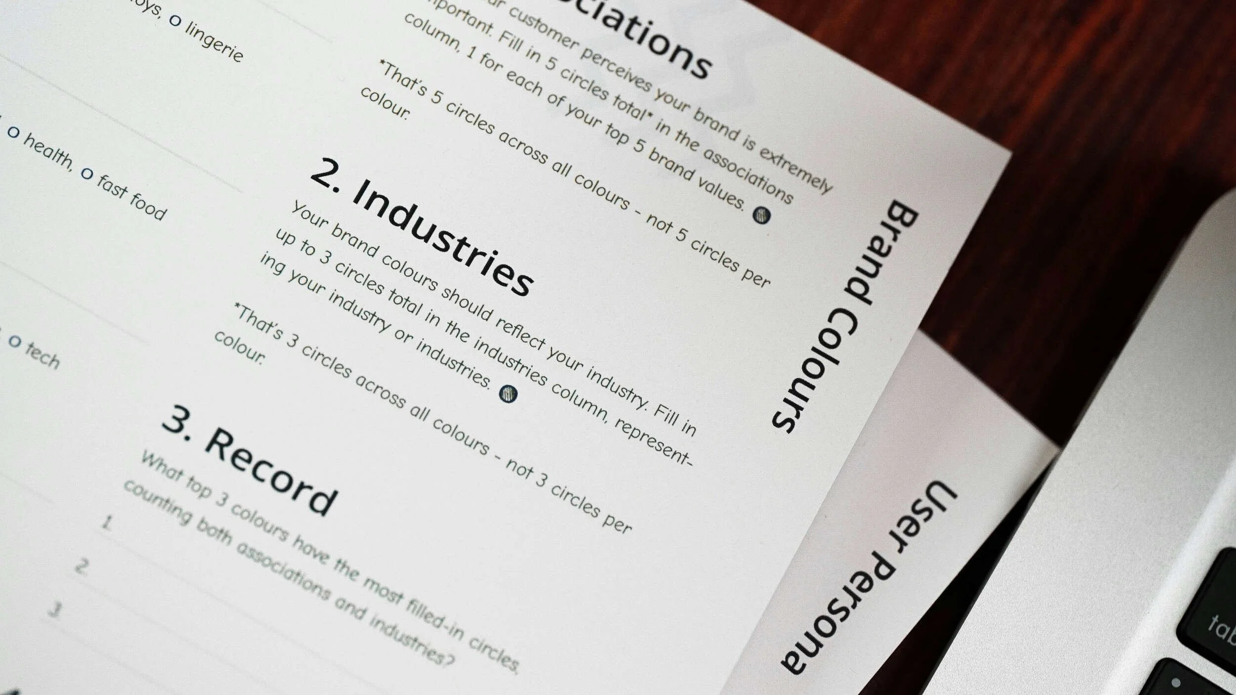 A stack of resumes near a laptop - why am I not getting interviews