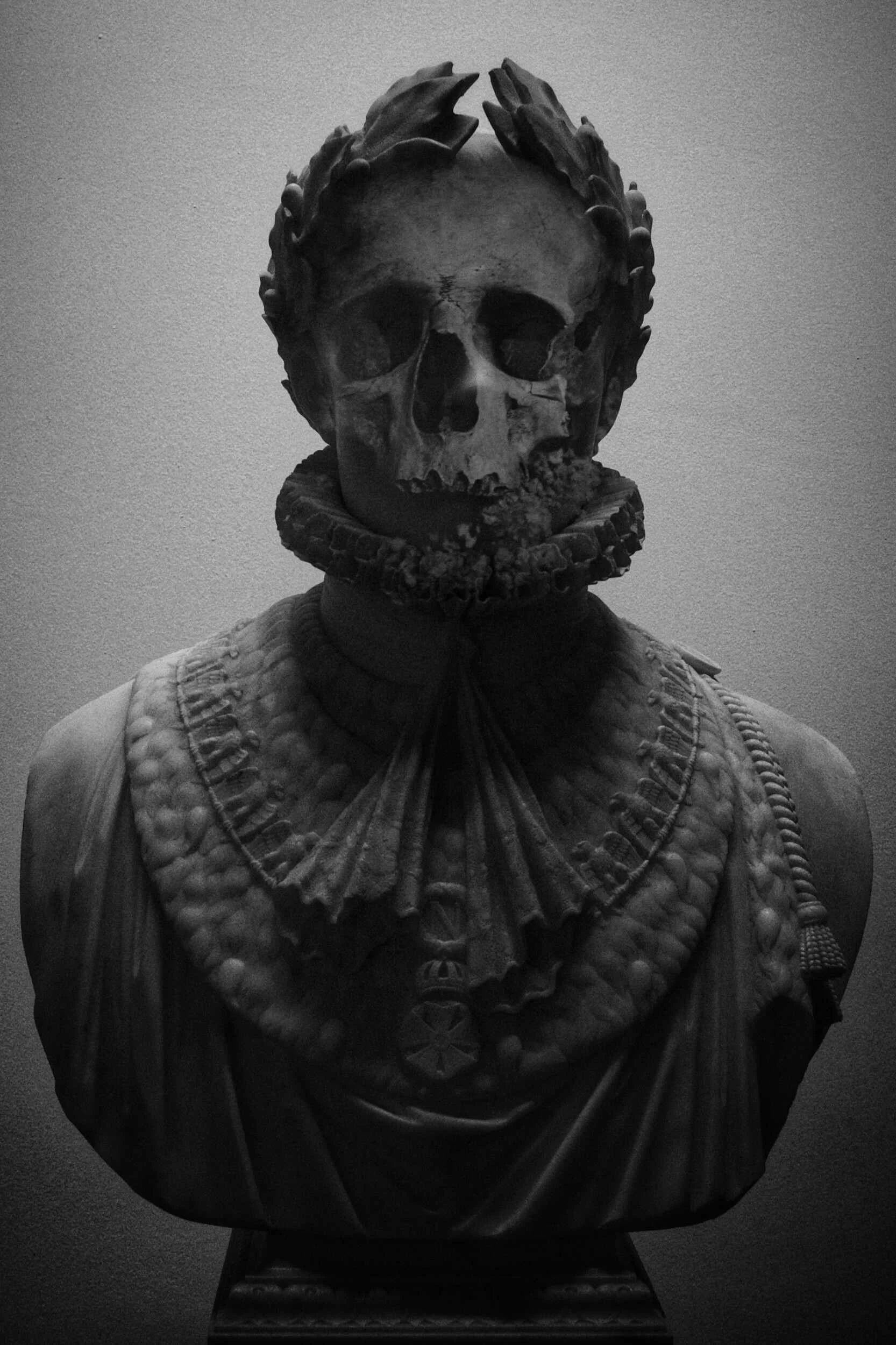 A skull and body cut out of marble - career coach