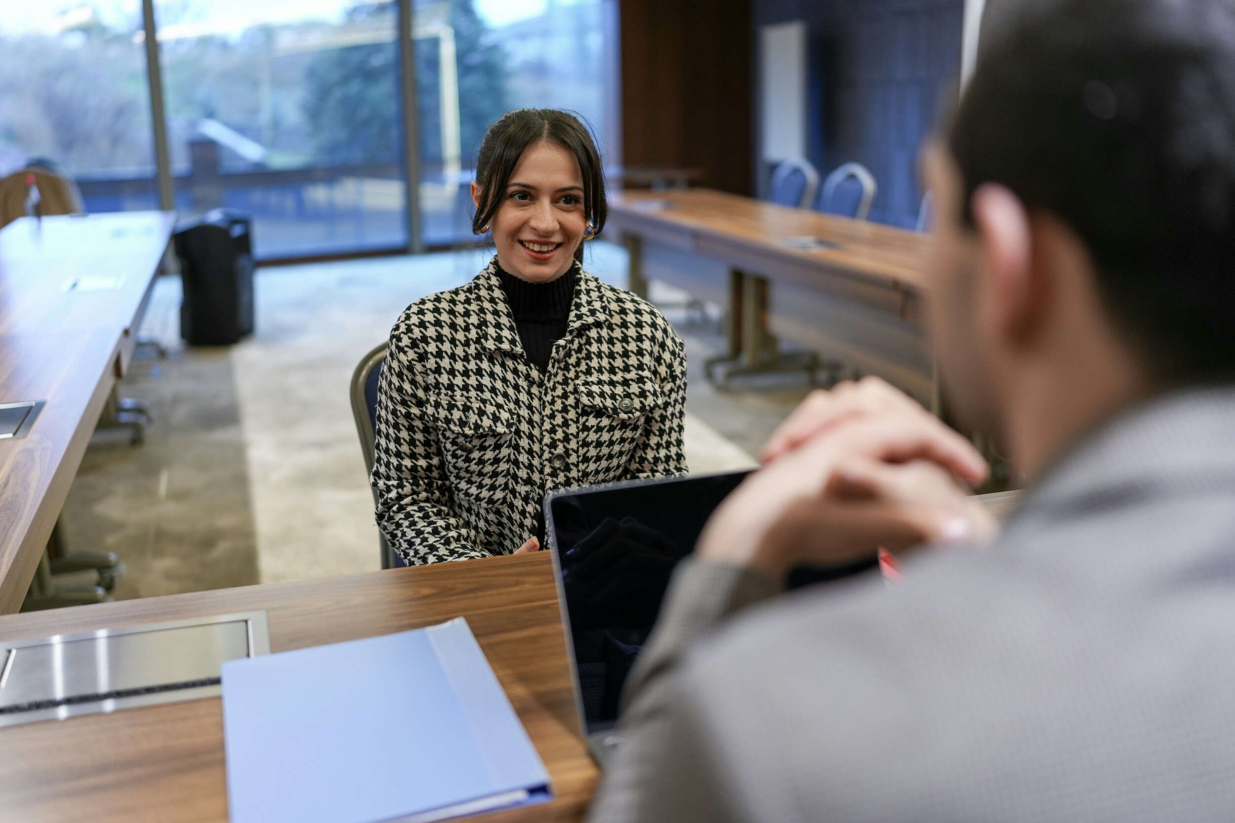 A women getting interviewed by a man across a table - interview coaching Phoenix