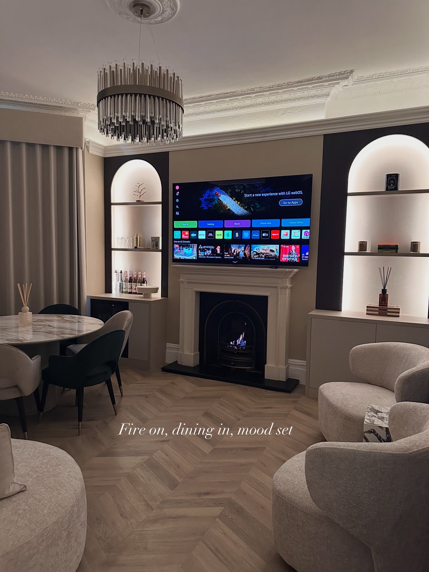 Designed and fitted by Zah Living &mdash; a room where classic architecture meets modern restraint. Victorian coving, bespoke arches, and layered lighting wrap the space in a warm glow, while marble, herringbone, and tailored joinery bring quiet luxu
