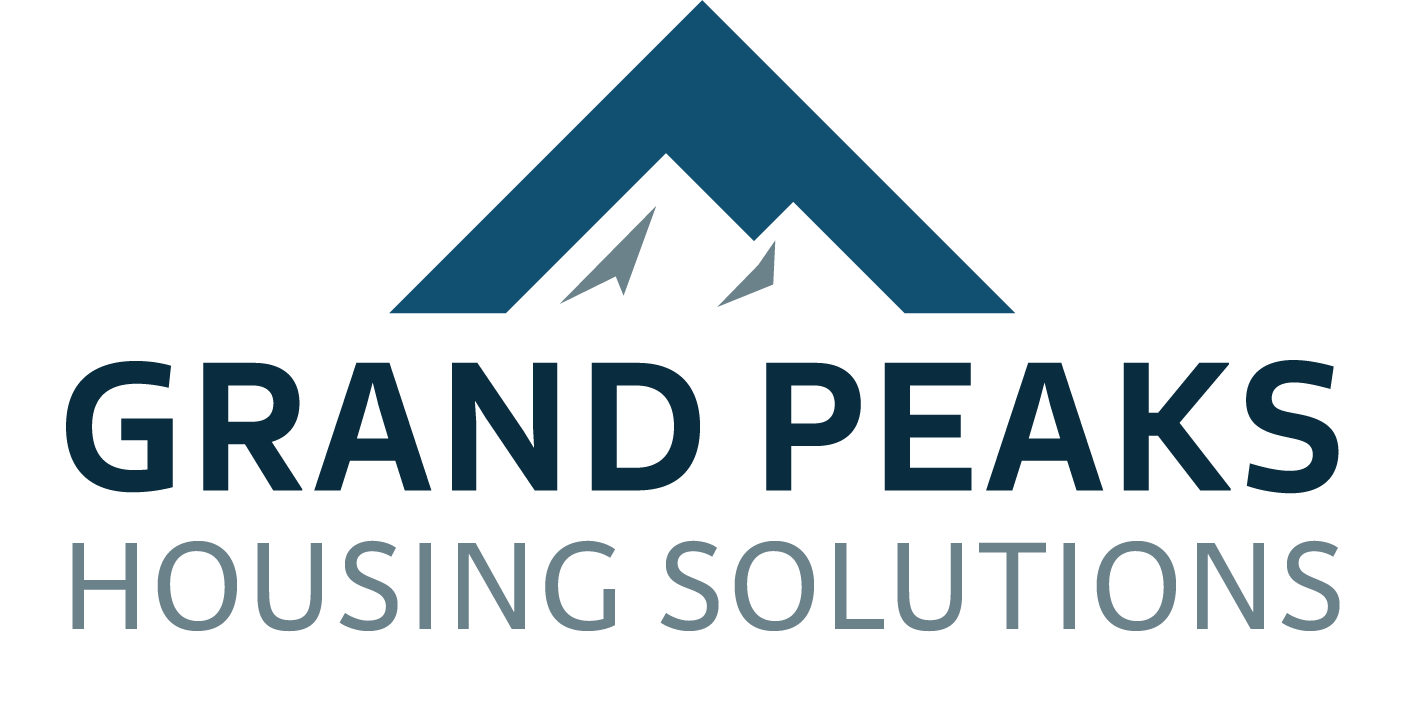 Logo with stylized mountain peaks above the text 'Grand Peaks Housing Solutions'