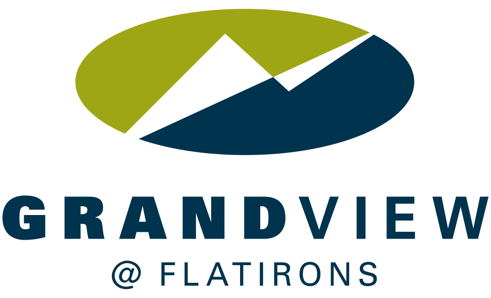 A logo for Grandview @ Flatirons displaying a stylized mountains on an oval background with green, olive, and navy blue colors.