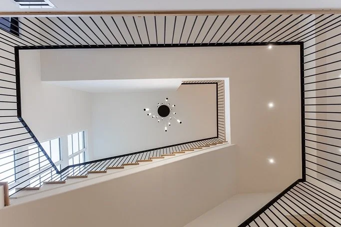 A stairwell like this doesn&rsquo;t just connect floors, it connects three full levels of thoughtfully designed living. Architecture that makes a statement from every angle!
&bull;
&bull;
#feinbrookconstruction #atlantacustomhomes #atlantahomebuilder
