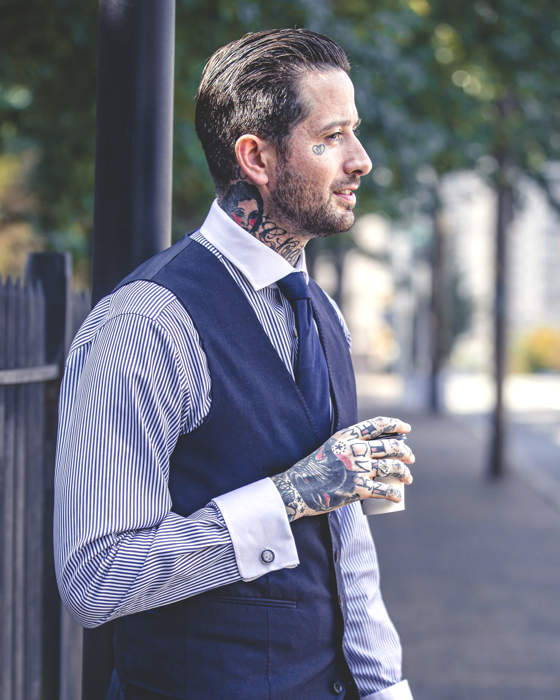 Thomas Mangum & Makocr8s.com photo of Creative professional holding coffee outdoors, representing personal branding, marketing strategy and visual storytelling.