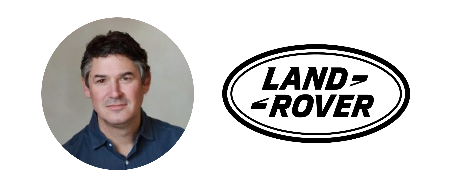 Portrait of a middle-aged man with dark hair and light skin, wearing a dark blue shirt, against a neutral background.