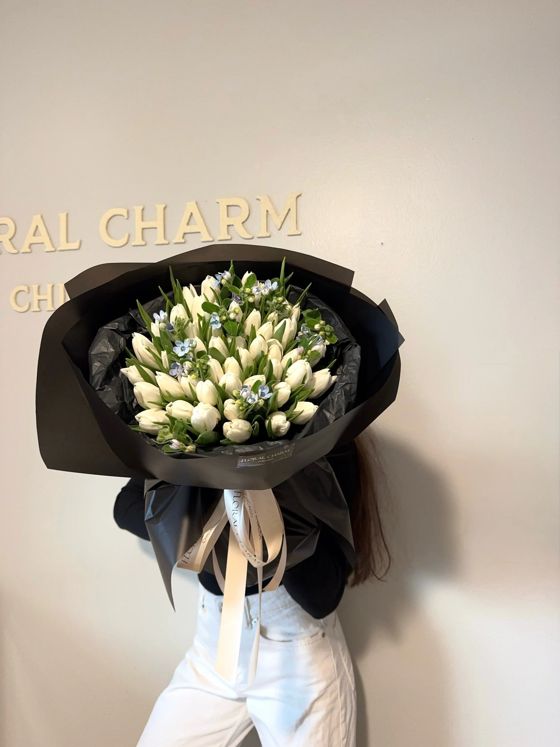 White tulips with tweedia