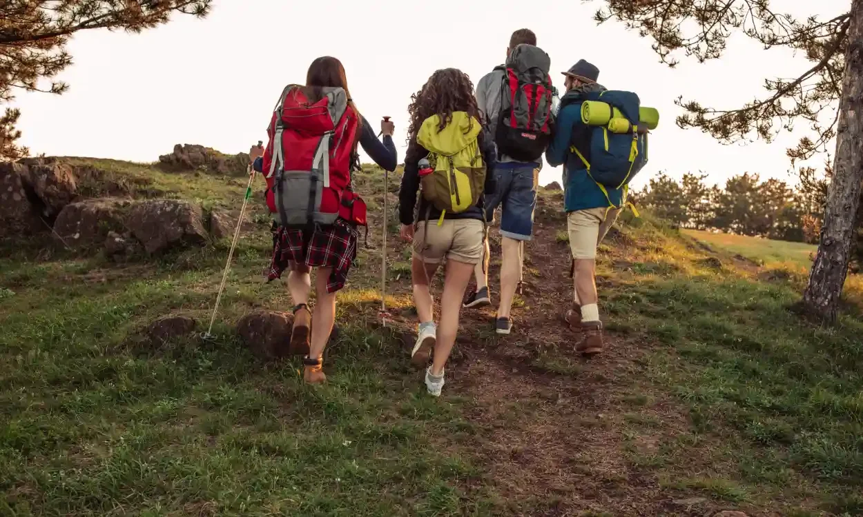 group backpacking up a trail