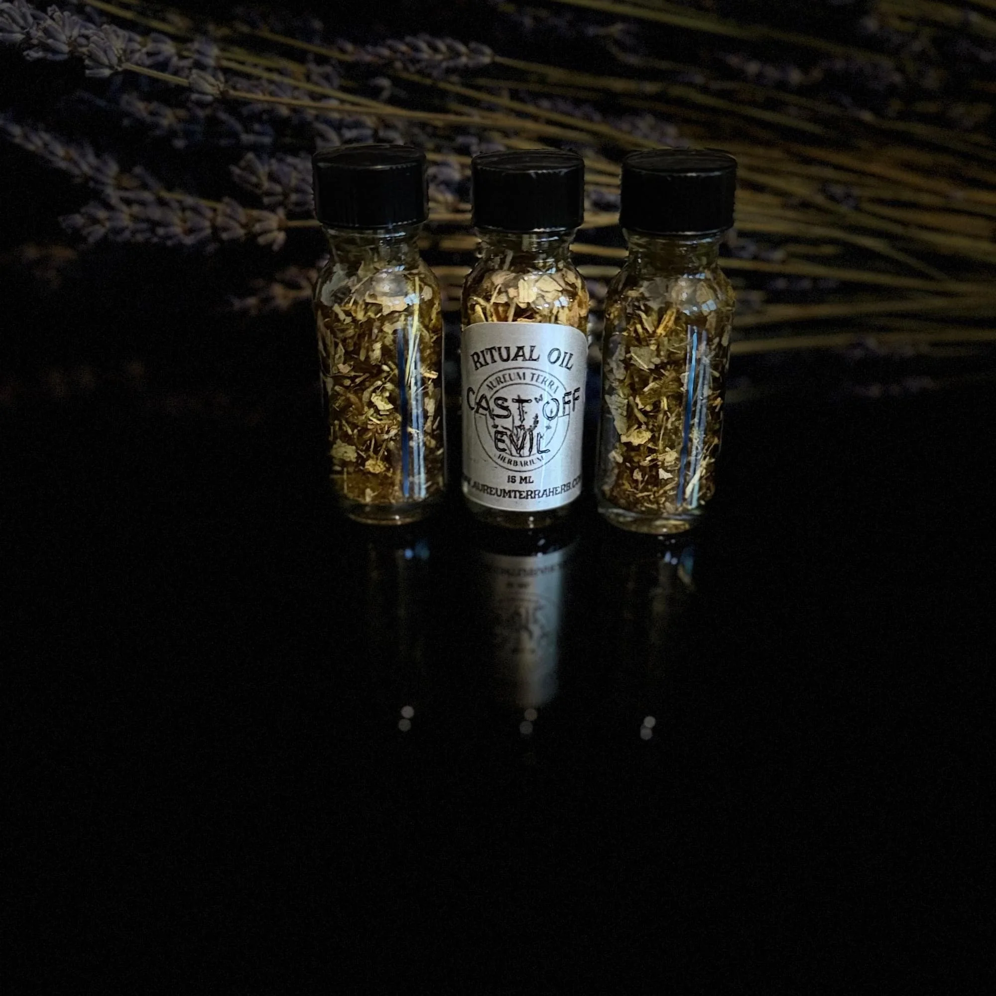 15ml bottle of Cast Off Evil Ritual Intention Oil by Aureum Terra Herbarium for releasing negativity and spiritual renewal