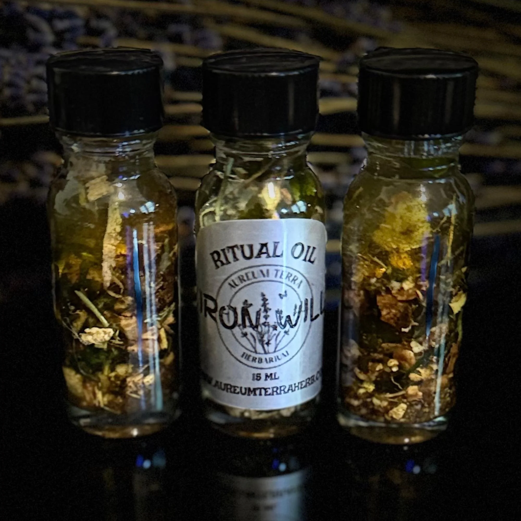 15ml bottle of IRON WILL Ritual Intention Oil by Aureum Terra Herbarium for power, control, and strategic mastery