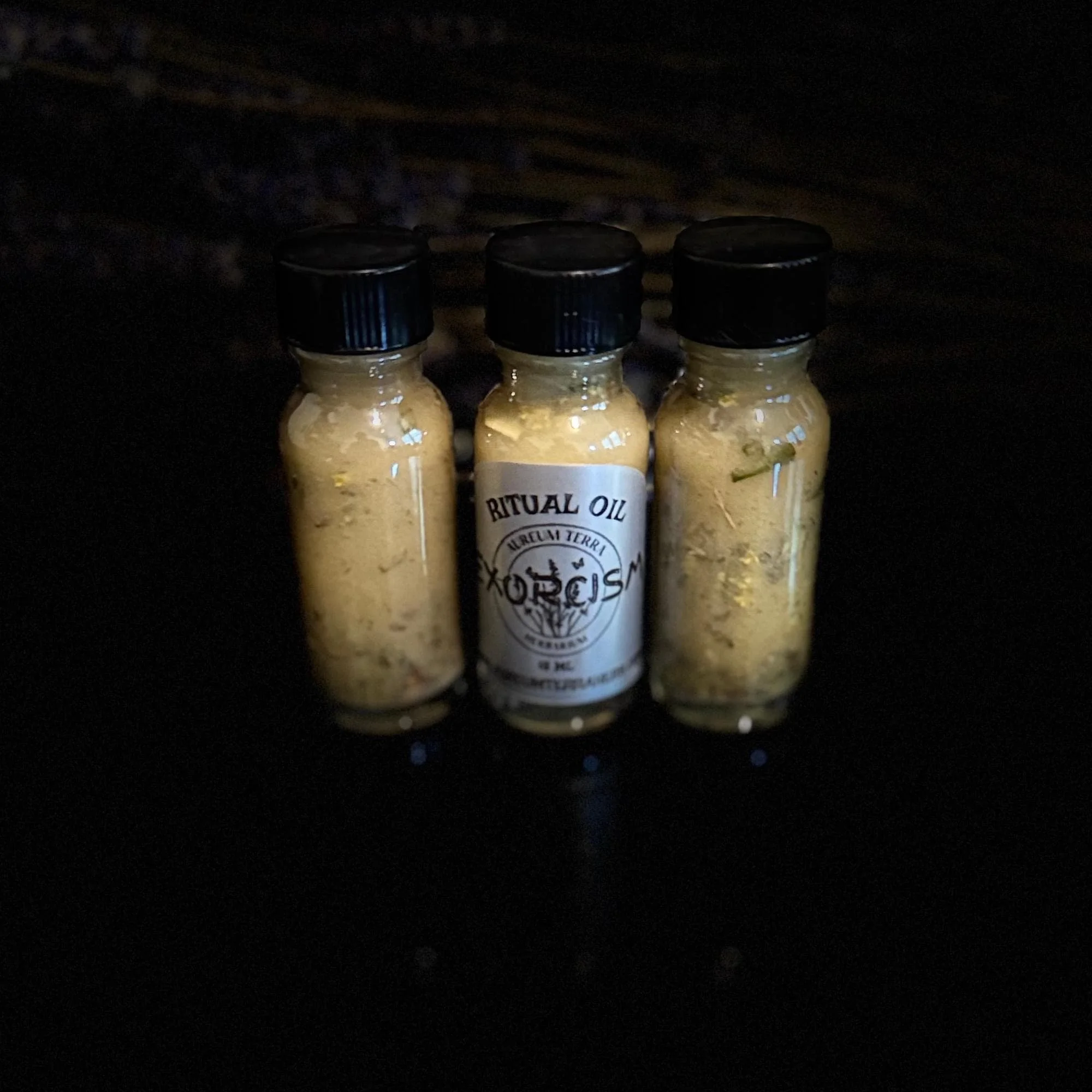 Glass bottle and solar-aligned botanicals of Exorcism Ritual Intention Oil
