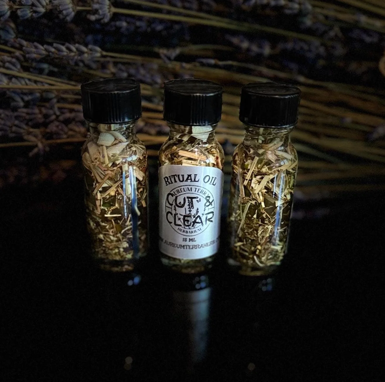 15ml bottle of Cut & Clear Ritual Intention Oil by Aureum Terra Herbarium for clarity, release, and cord cutting