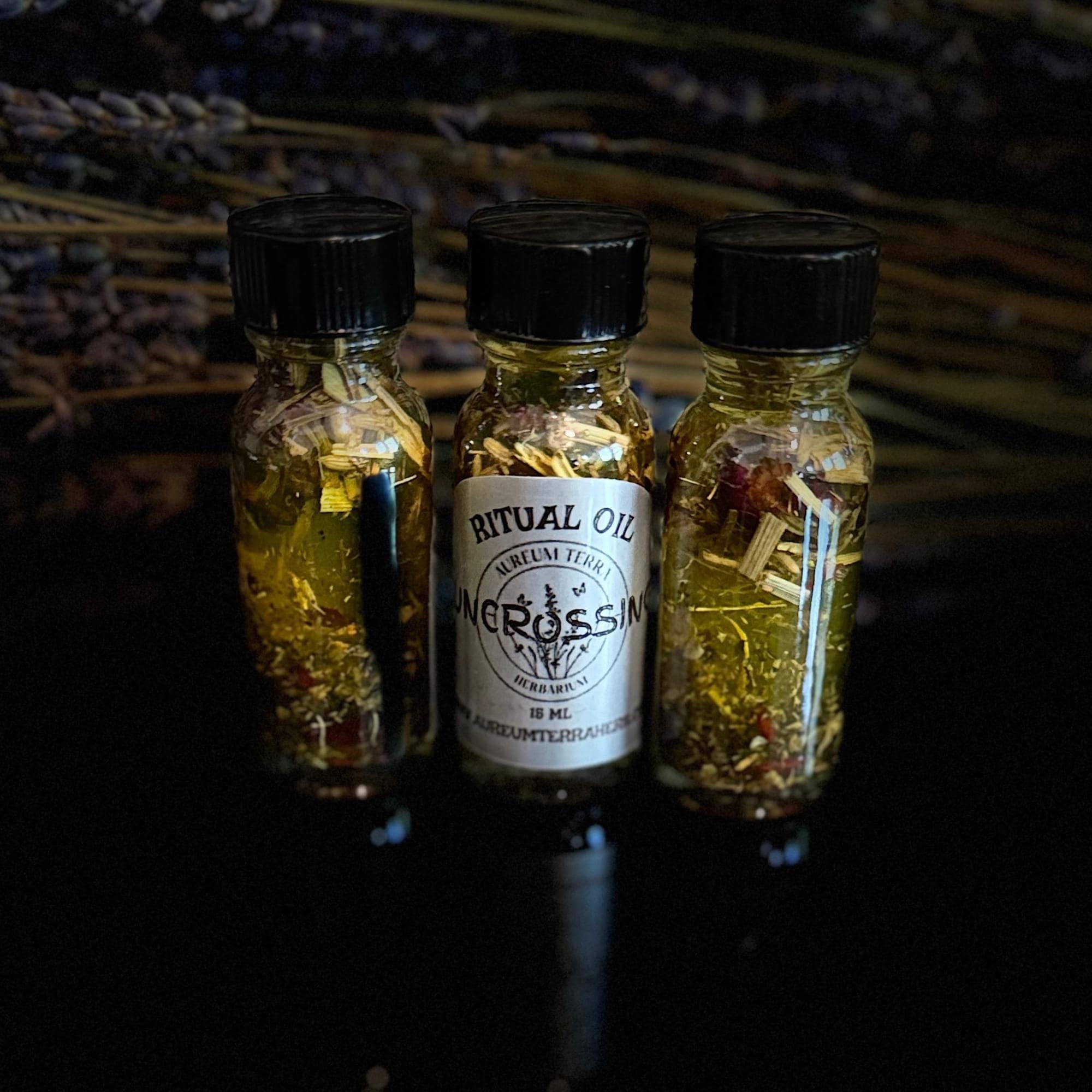 Botanical ingredients and glass bottle of Uncrossing Ritual Intention Oil
