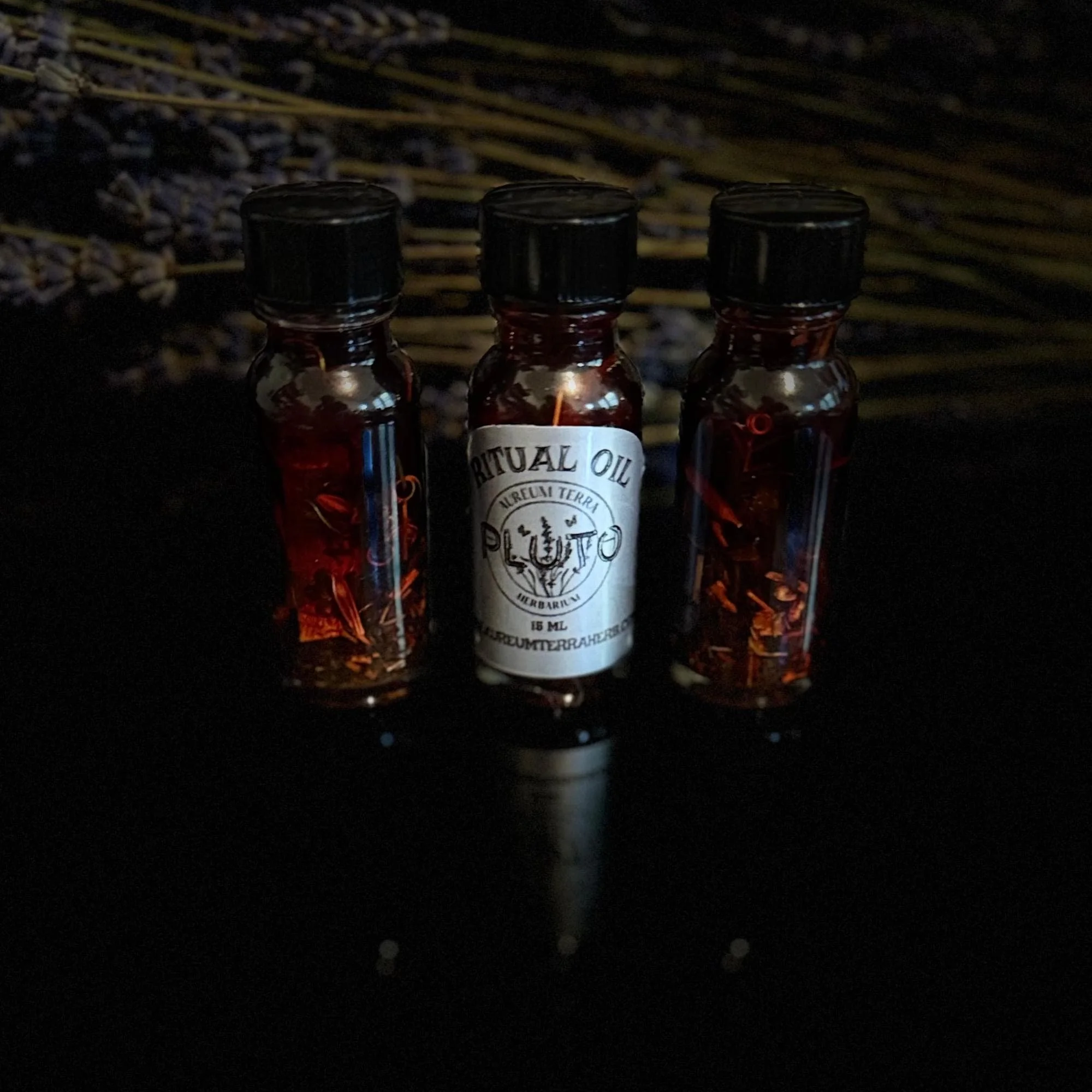 Pluto Ritual Intention Herbarium Oil with botanicals for transformation, protection, and personal power