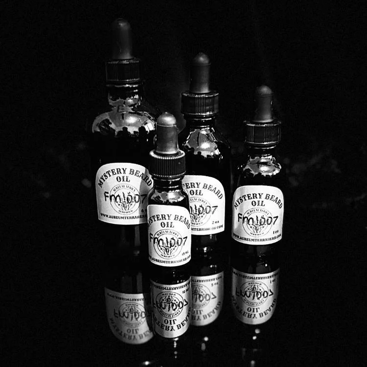Mystery Beard Oil Formula 007 by Aureum Terra Herb with sweet orange, cardamom, and tobacco oud in refillable glass bottle