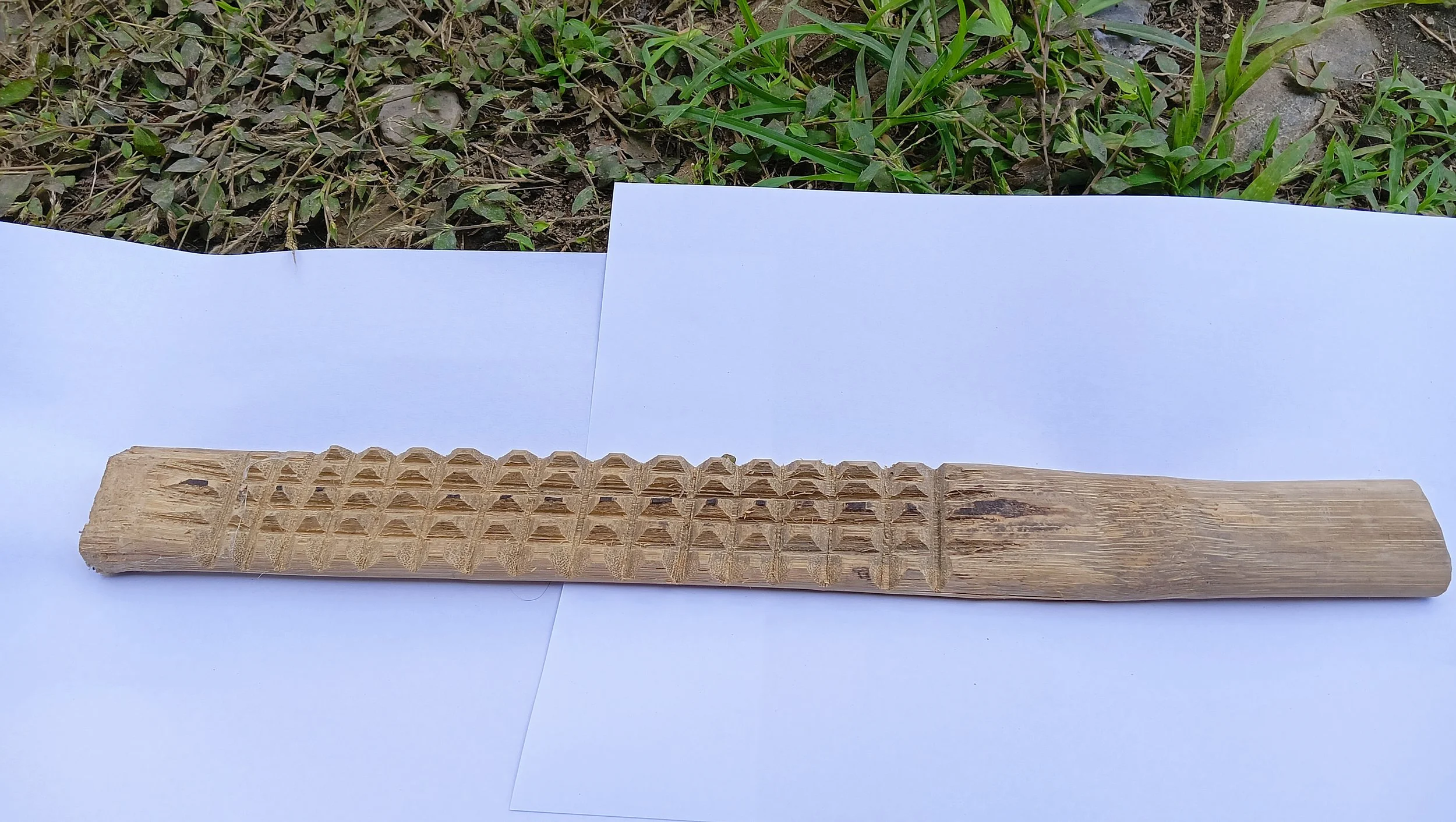 The /kamgi/ is a traditional tool used in Nyishi pottery to flatten the surface of clay pots that gives the specific design and traditional uniqueness and identity. The /kamgi/ is used in conjunction with a round stone or other simple implement to sm