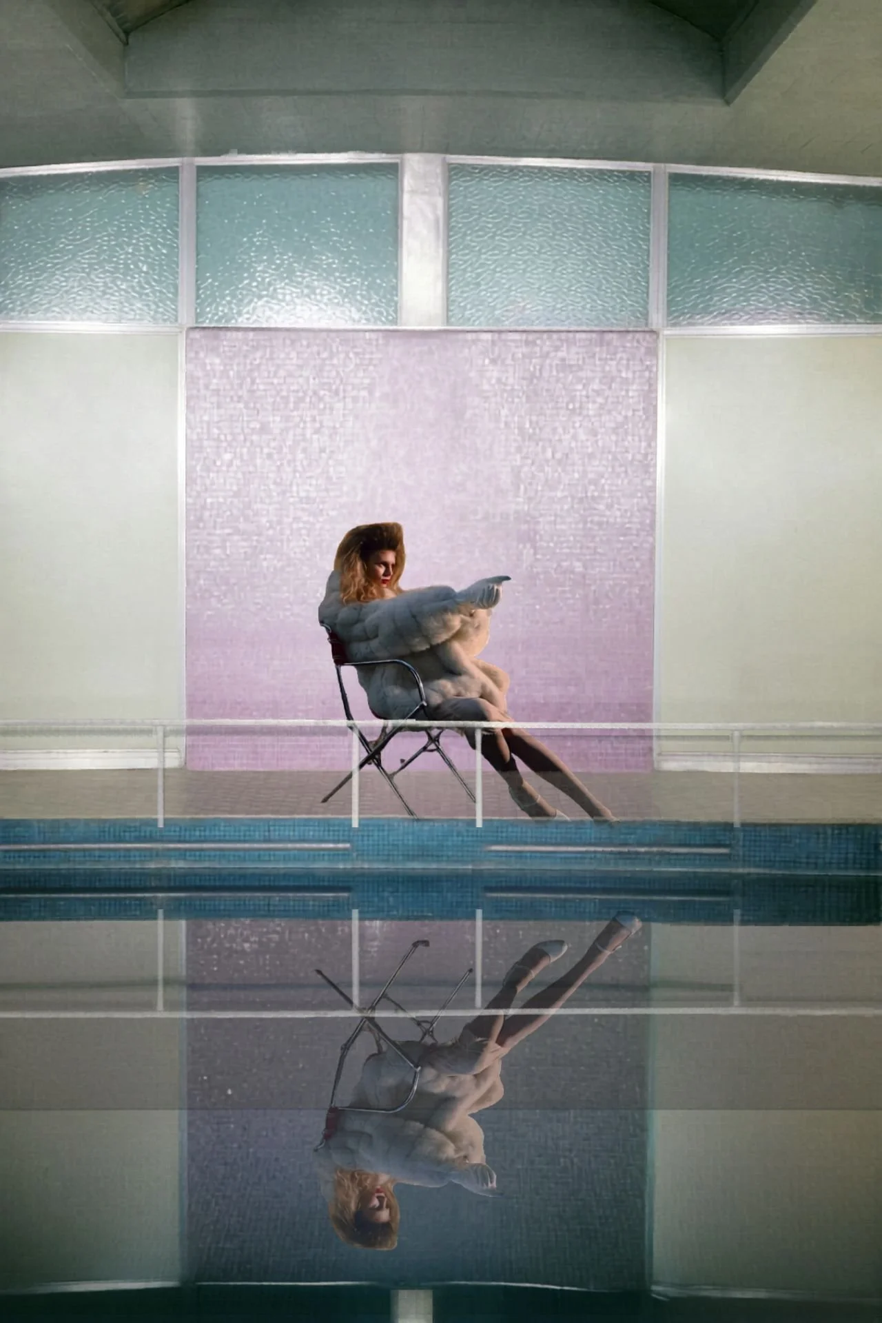 woman in pool with gun