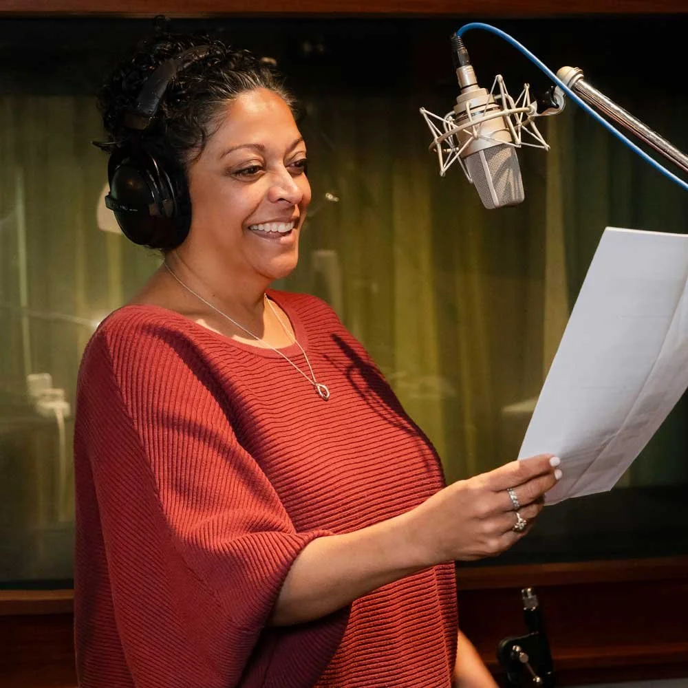 Client recording in a professional studio during a Your Voice Coaching voice coaching session.
