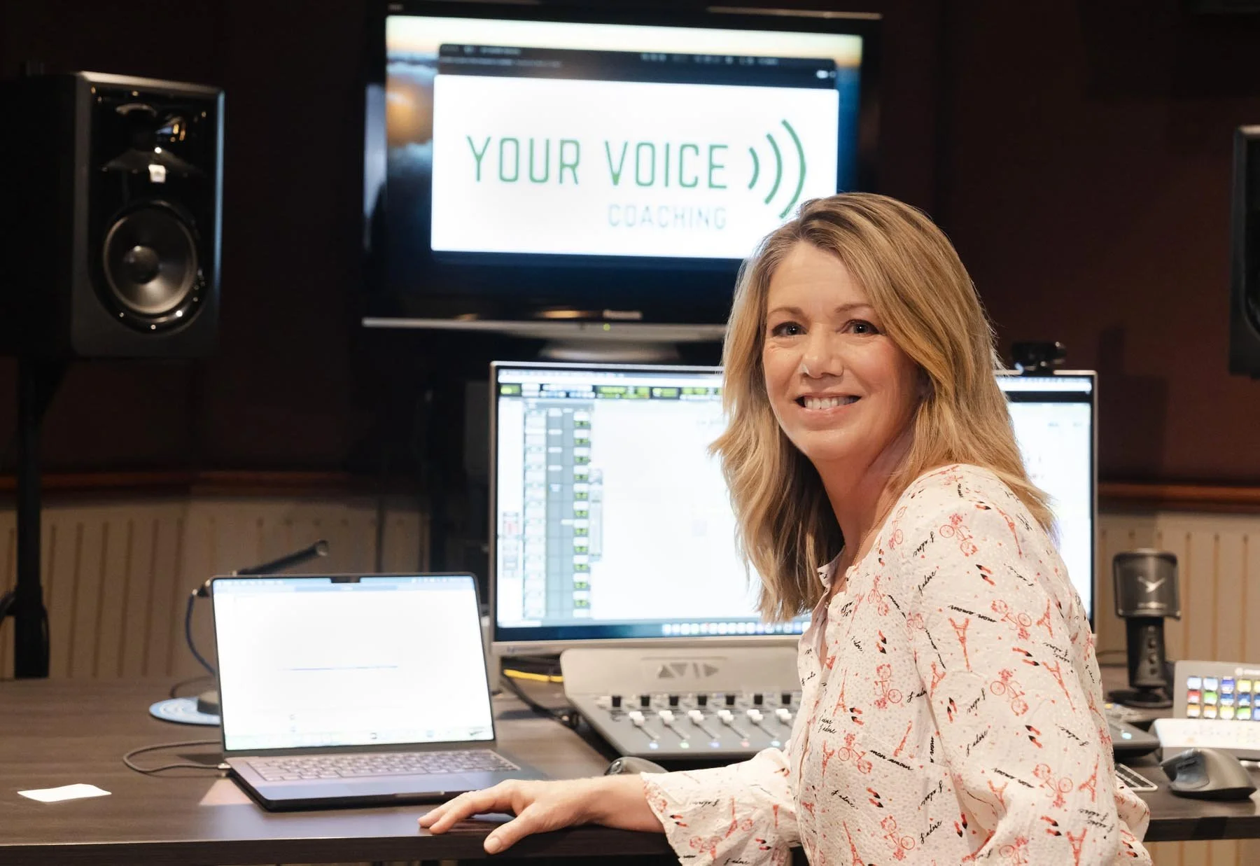 Sharon Hunter in a professional recording studio during a voice coaching session.