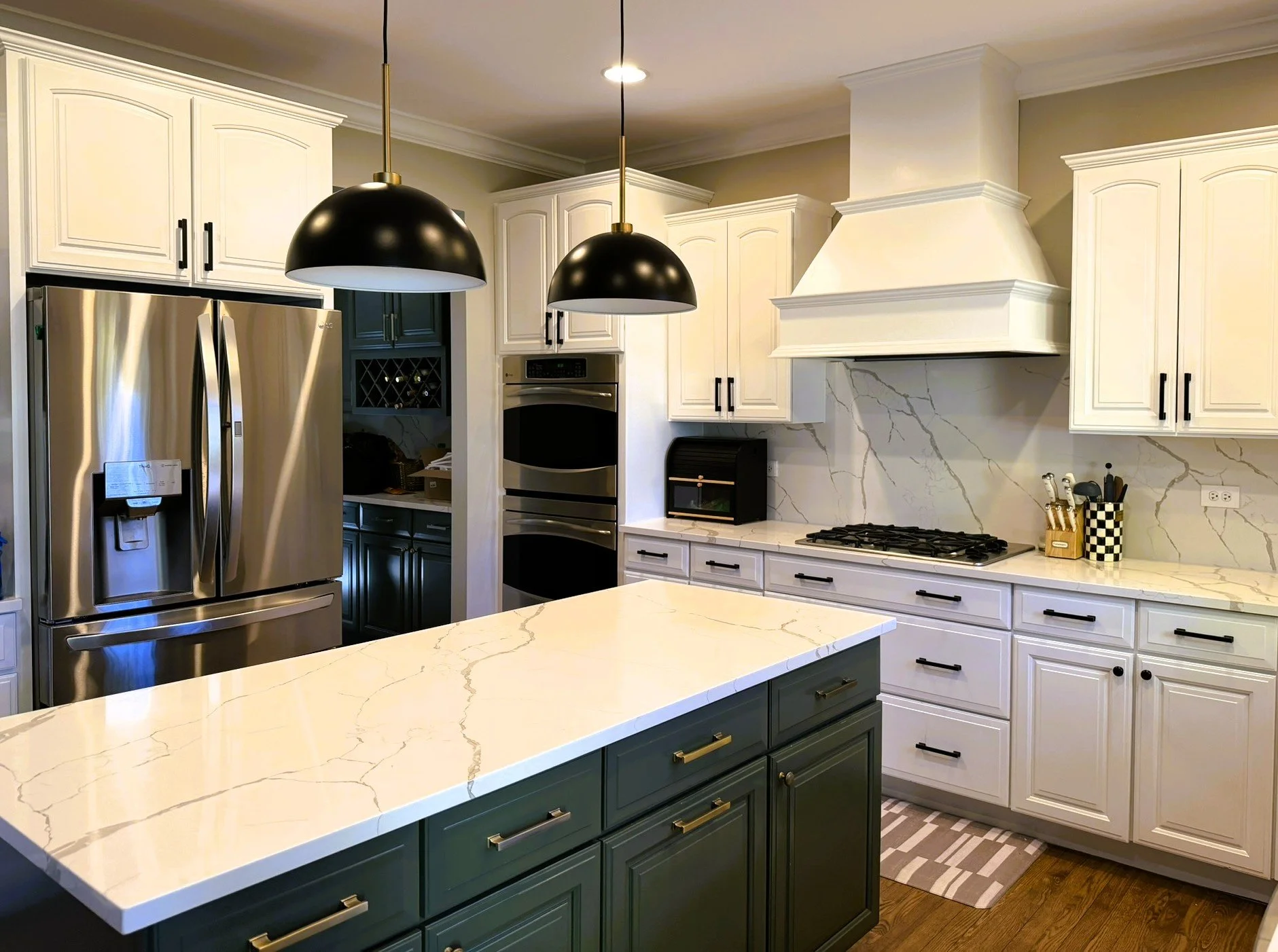 Third Street Interiors (Elmhurst-based interior design firm) featured interior design project of a kitchen refresh in Naperville, IL with painted cabinets, new hardware and light fixtures.