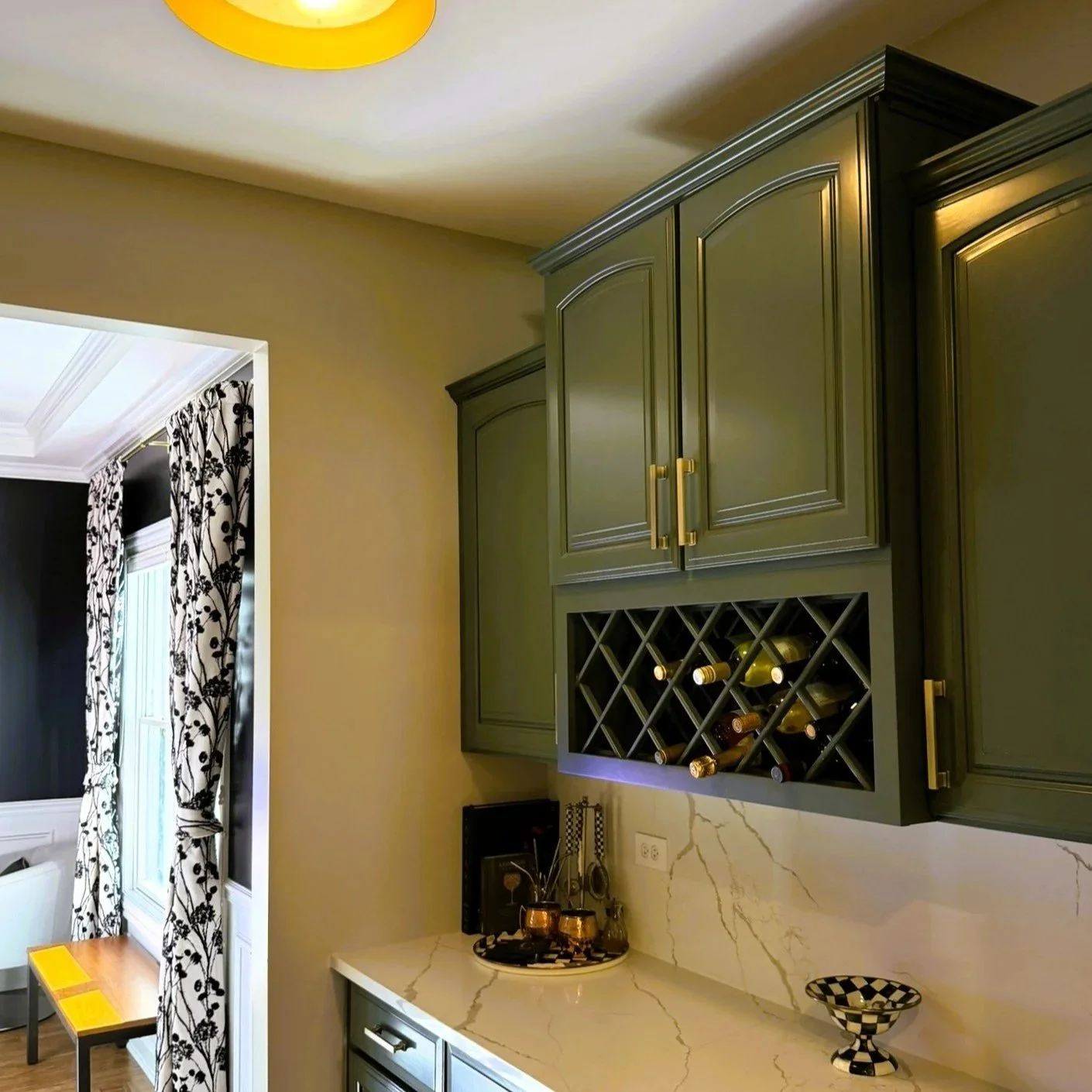 Third Street Interiors (Elmhurst-based interior design firm) featured interior design project of a kitchen refresh in Naperville, IL with painted cabinets, new hardware and light fixtures.