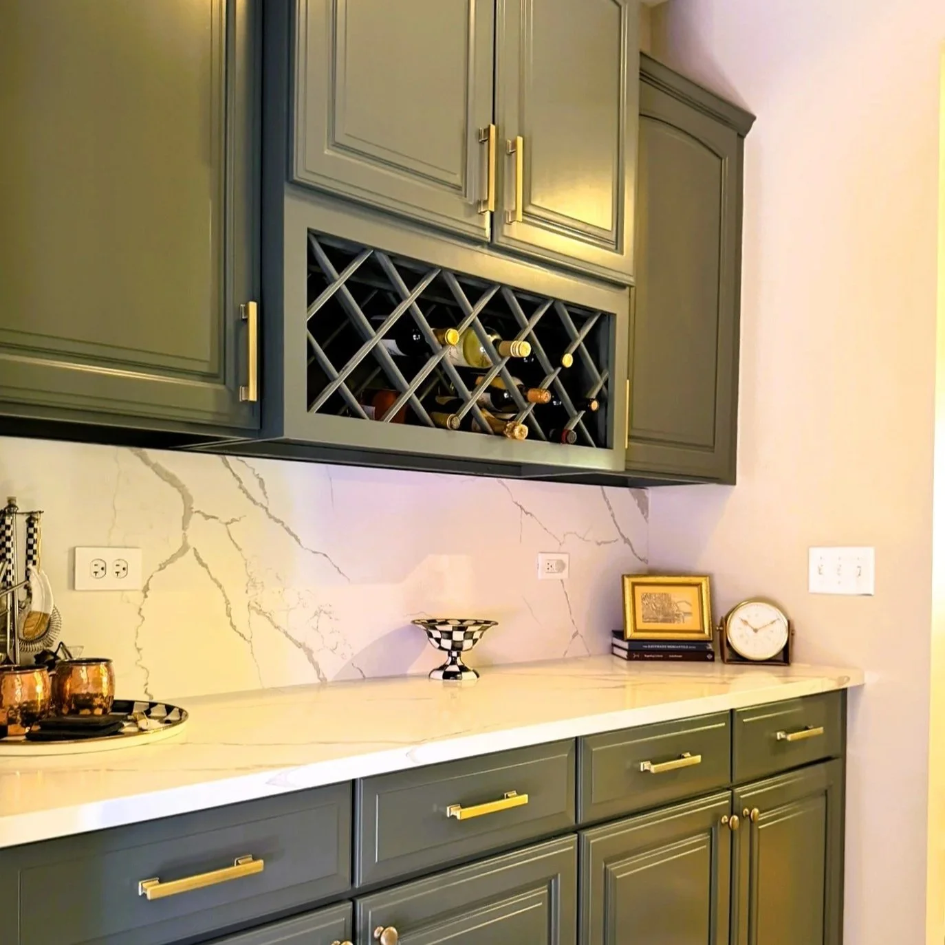 Third Street Interiors (Elmhurst-based interior design firm) featured interior design project of a kitchen refresh in Naperville, IL with painted cabinets, new hardware and light fixtures.