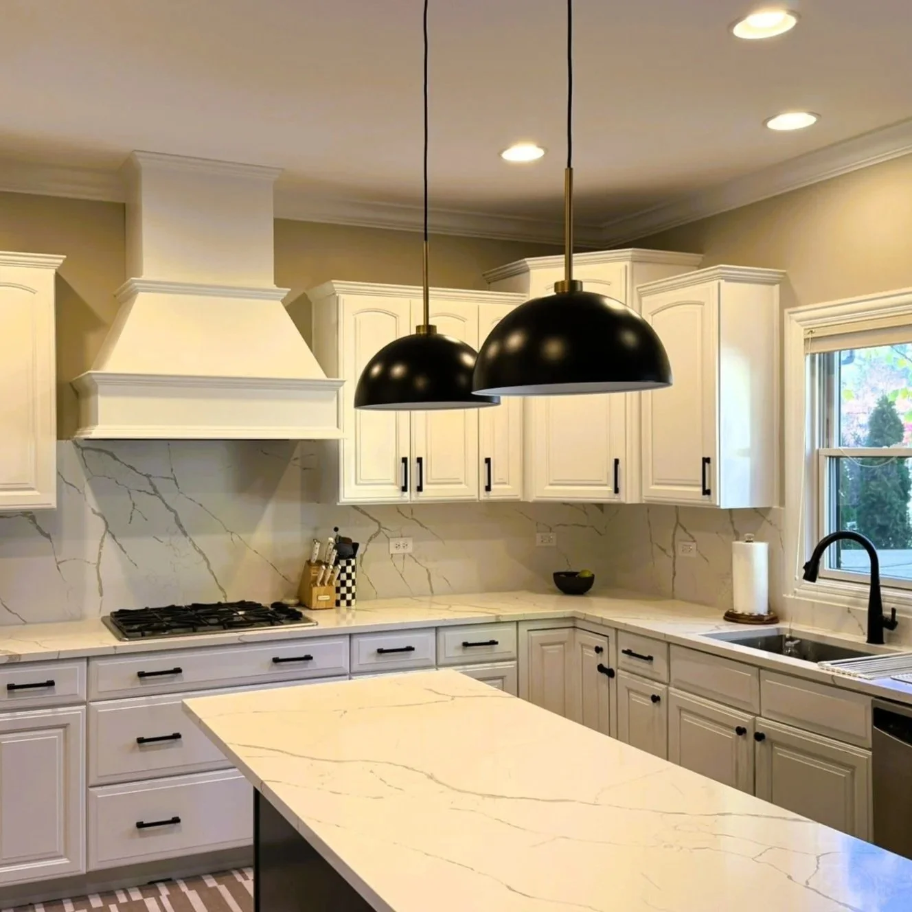 Third Street Interiors (Elmhurst-based interior design firm) featured interior design project of a kitchen refresh in Naperville, IL with painted cabinets, new hardware and light fixtures.