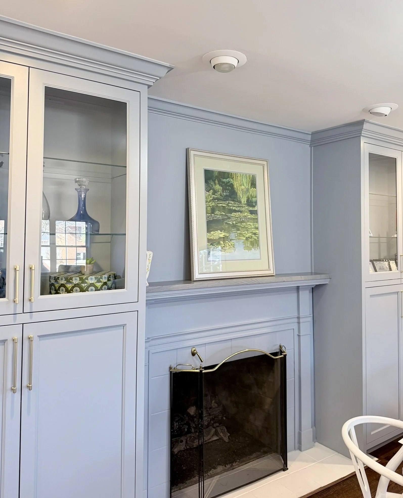 Third Street Interiors (Elmhurst-based interior design firm) featured interior design project of a kitchen remodel in Northfield, IL with gorgeous custom cabinets, contrasting countertops, and fireplace built-ins.