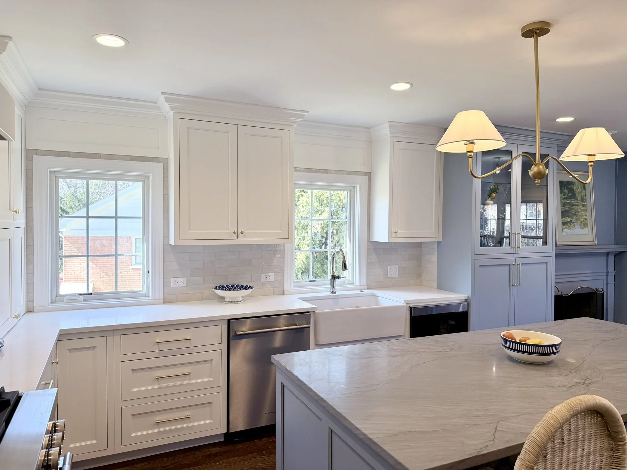 Third Street Interiors (Elmhurst-based interior design firm) featured interior design project of a kitchen remodel in Northfield, IL with gorgeous custom cabinets, contrasting countertops, and fireplace built-ins.