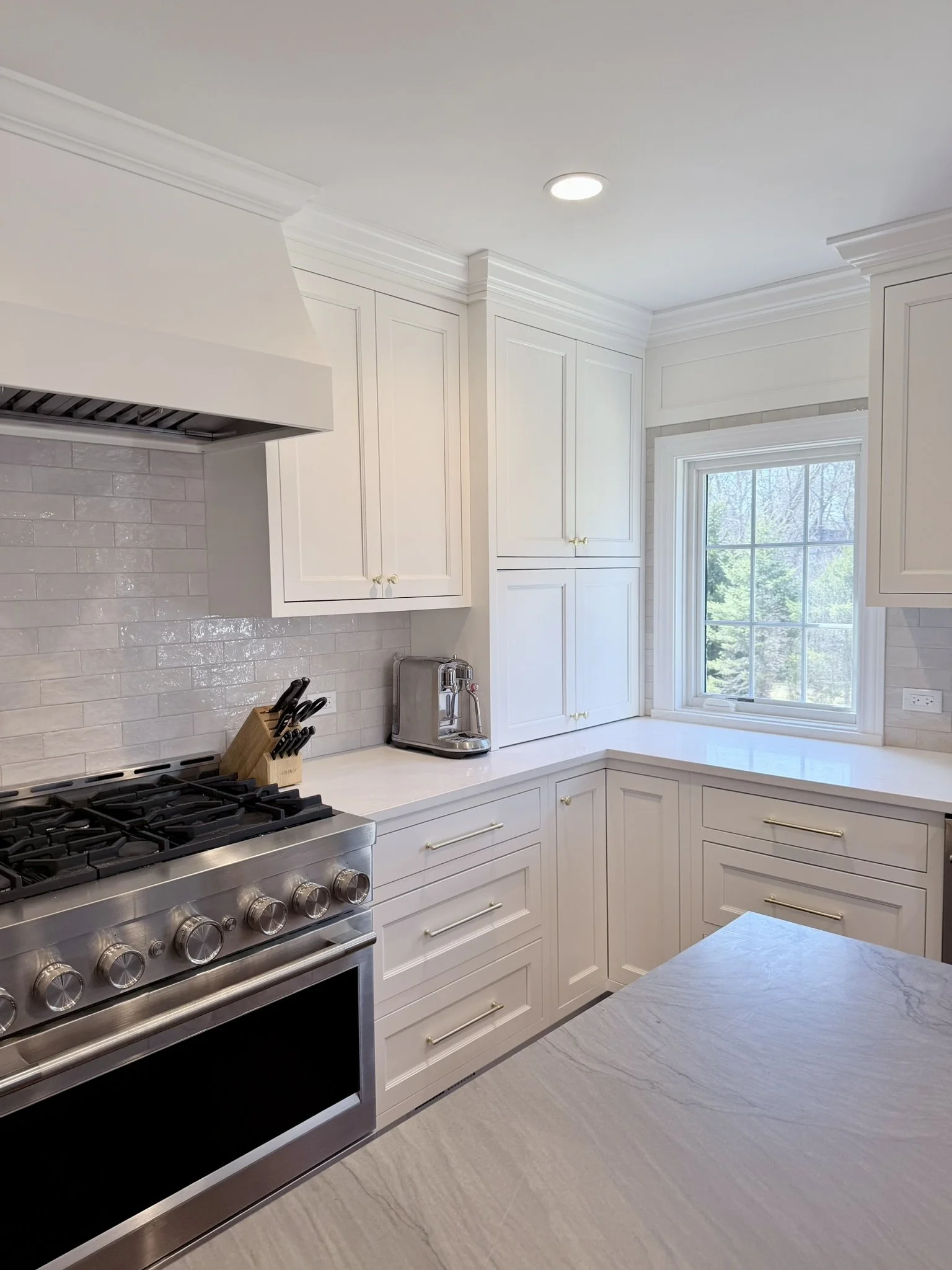 Third Street Interiors (Elmhurst-based interior design firm) featured interior design project of a kitchen remodel in Northfield, IL with gorgeous custom cabinets, contrasting countertops, and fireplace built-ins.