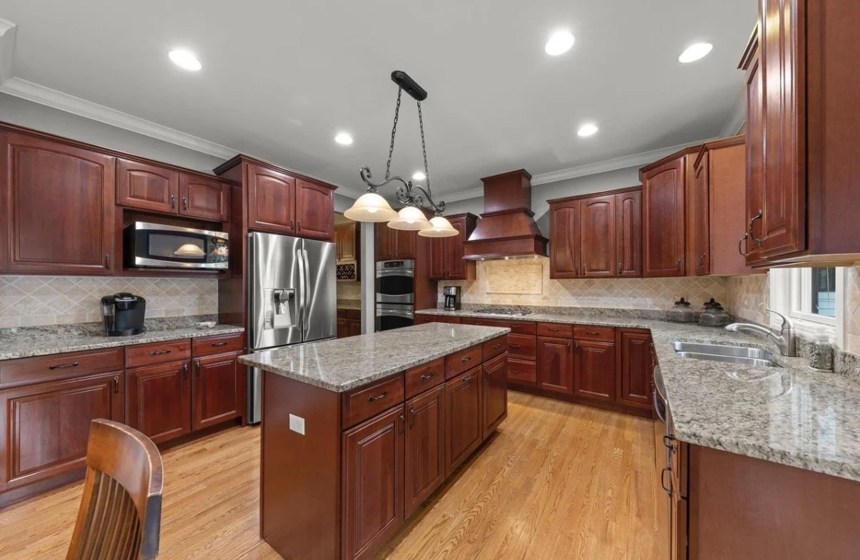 Third Street Interiors (Elmhurst-based interior design firm) featured interior design project of a kitchen refresh in Naperville, IL with painted cabinets, new hardware and light fixtures.