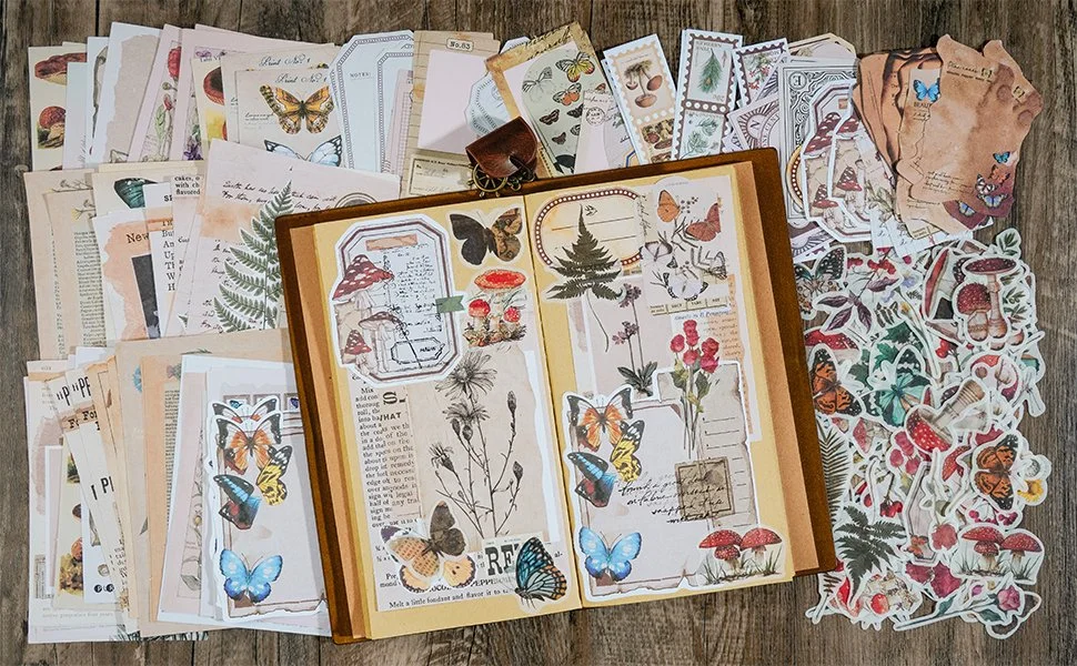 A book opened up sitting in the middle of a table surrounded by different stickers.. Book pages covered with different stickers.