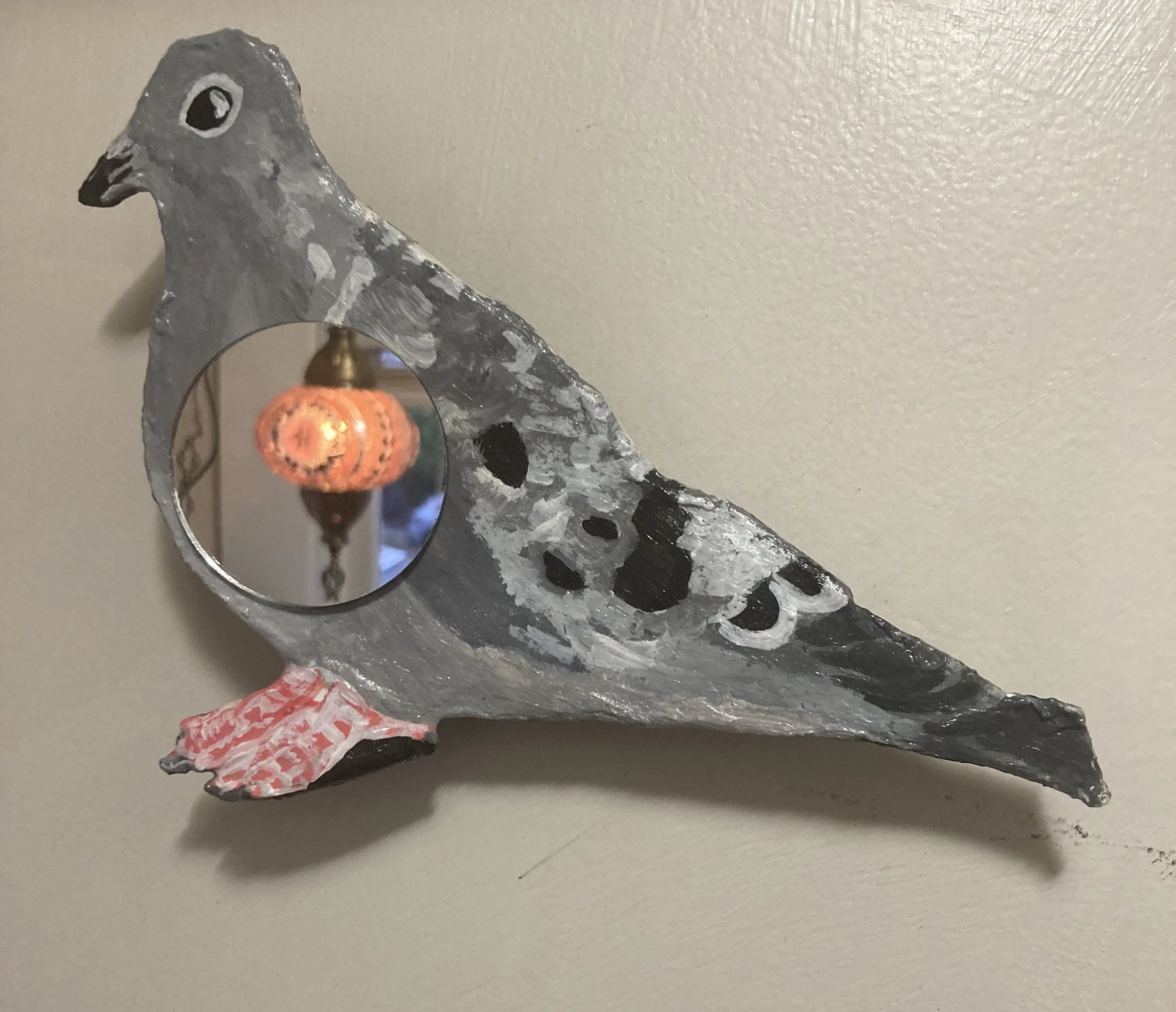 Gray pigeon mirror