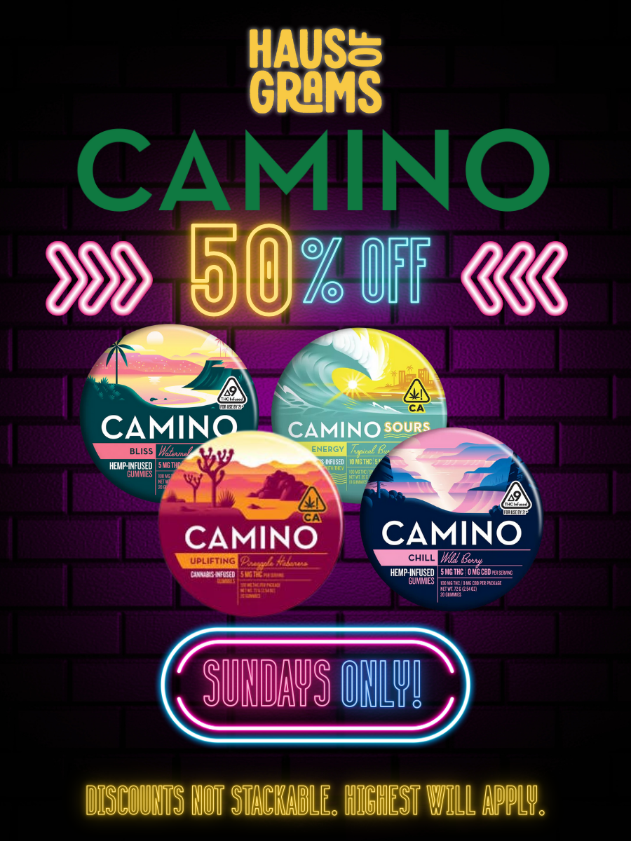 Neon sign advertising a sale on Camino cannabis-infused gummies with 50% off every Sunday, featuring colorful neon text and images of four different gummy packages against a dark brick wall background.