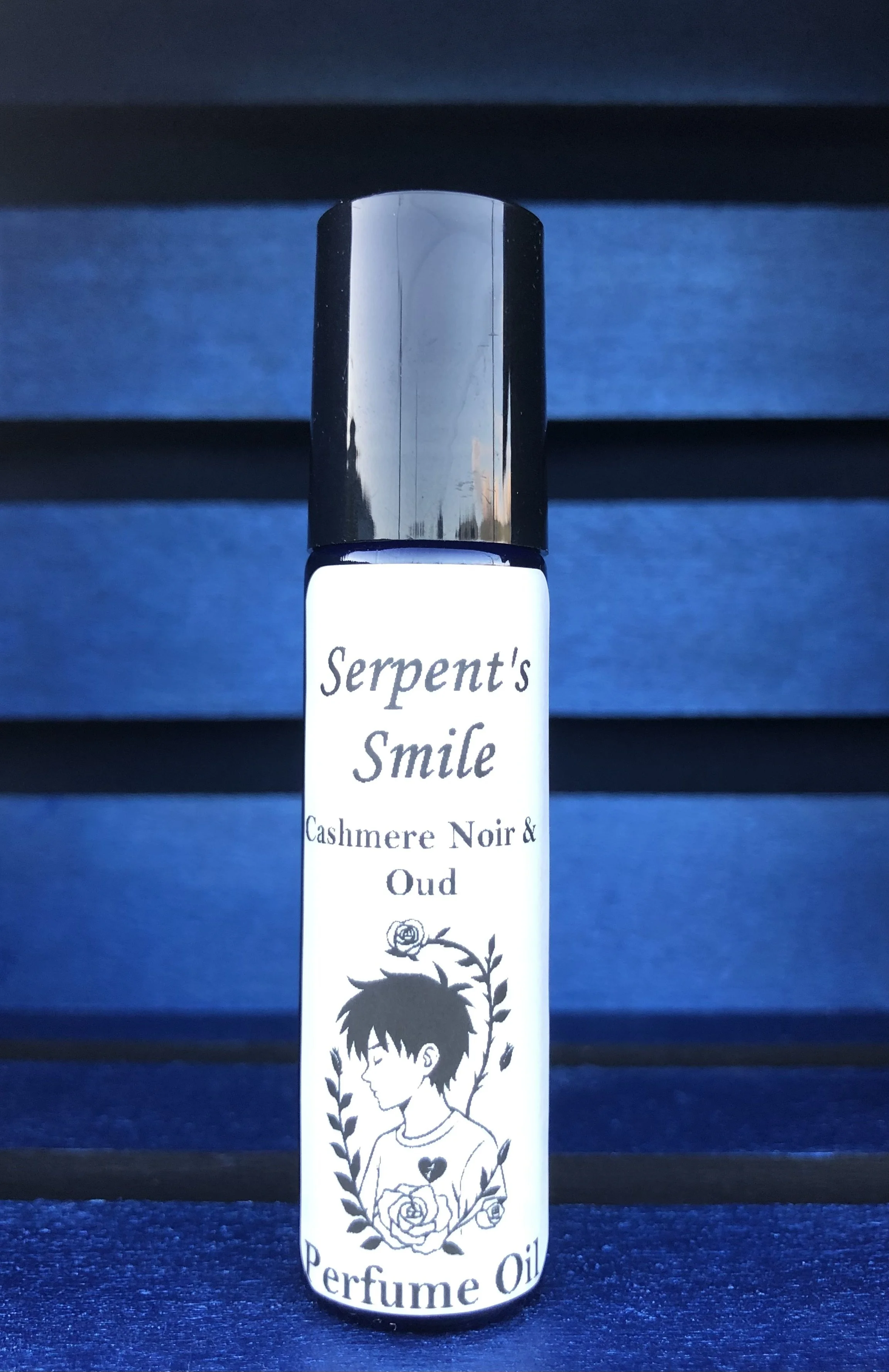 Serpent's Smile: Cashmere Noir & Oud Perfume Oil Roll-On