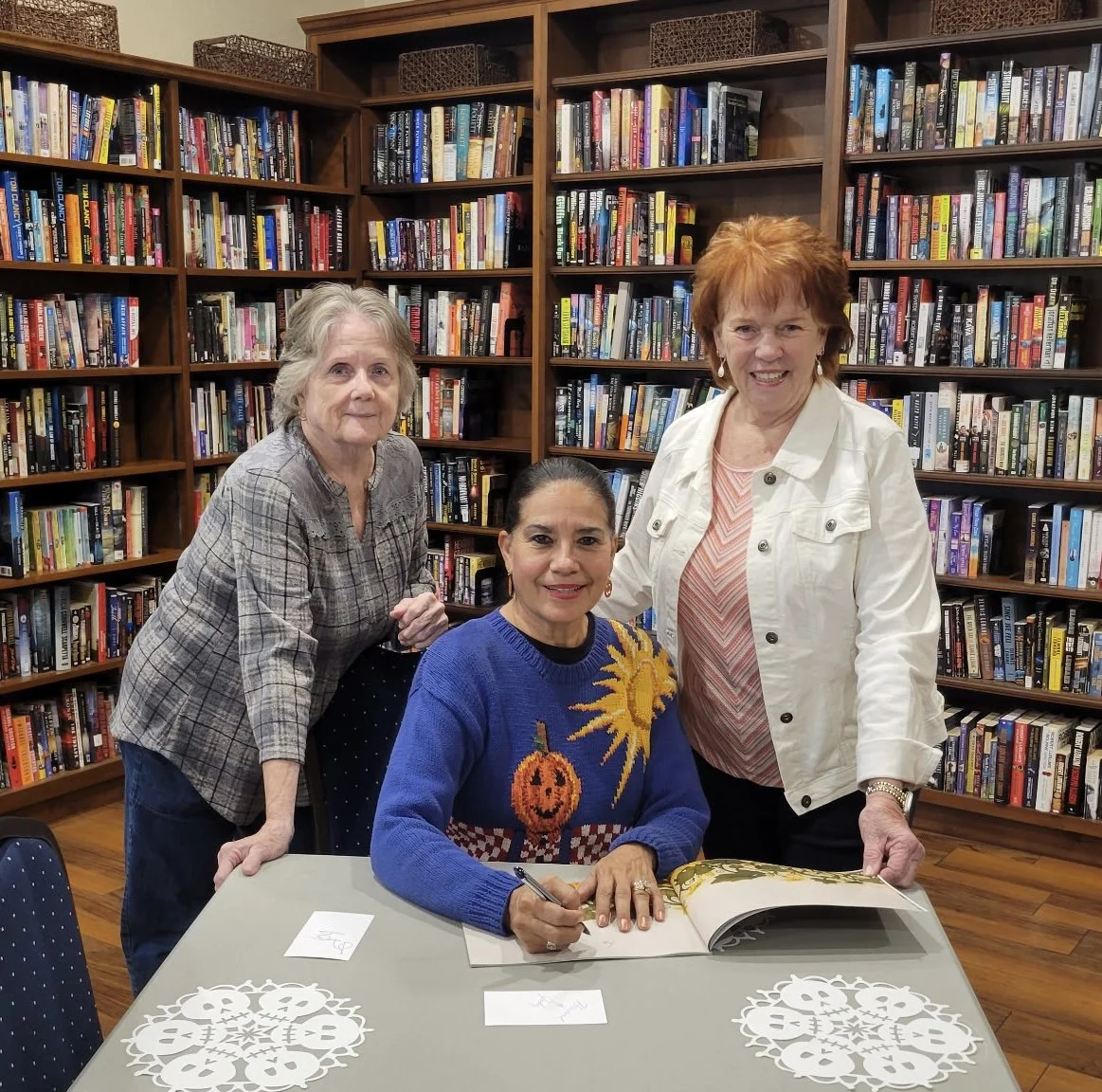 Author Gloria Reyes at a book signing for her children's book The Joyful Pumpkin