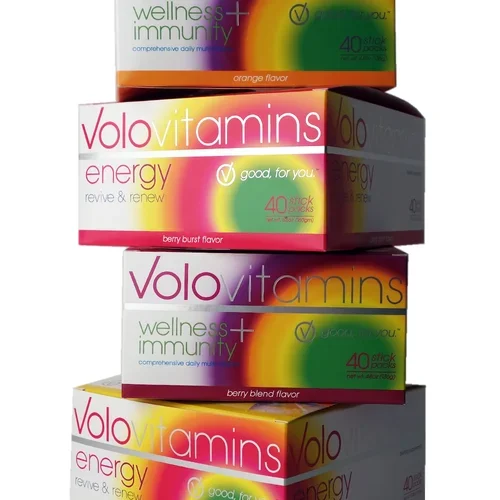 Stacked boxes of Volo vitamins with flavors including orange, berry burst, and berry blend, branded as wellness and immune support.