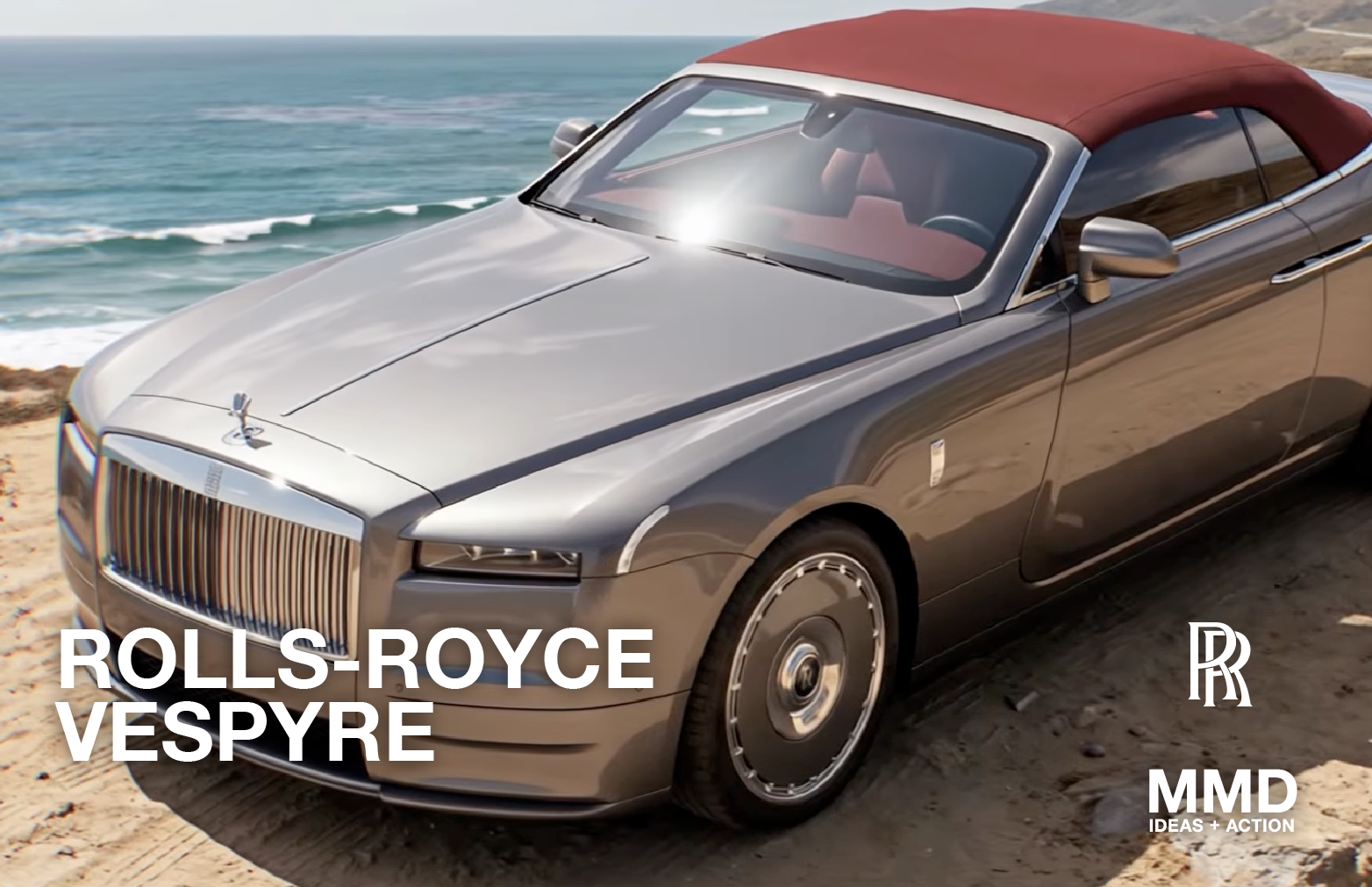 A gray Rolls-Royce Wespyre convertible parked on a sandy beach with ocean waves in the background.