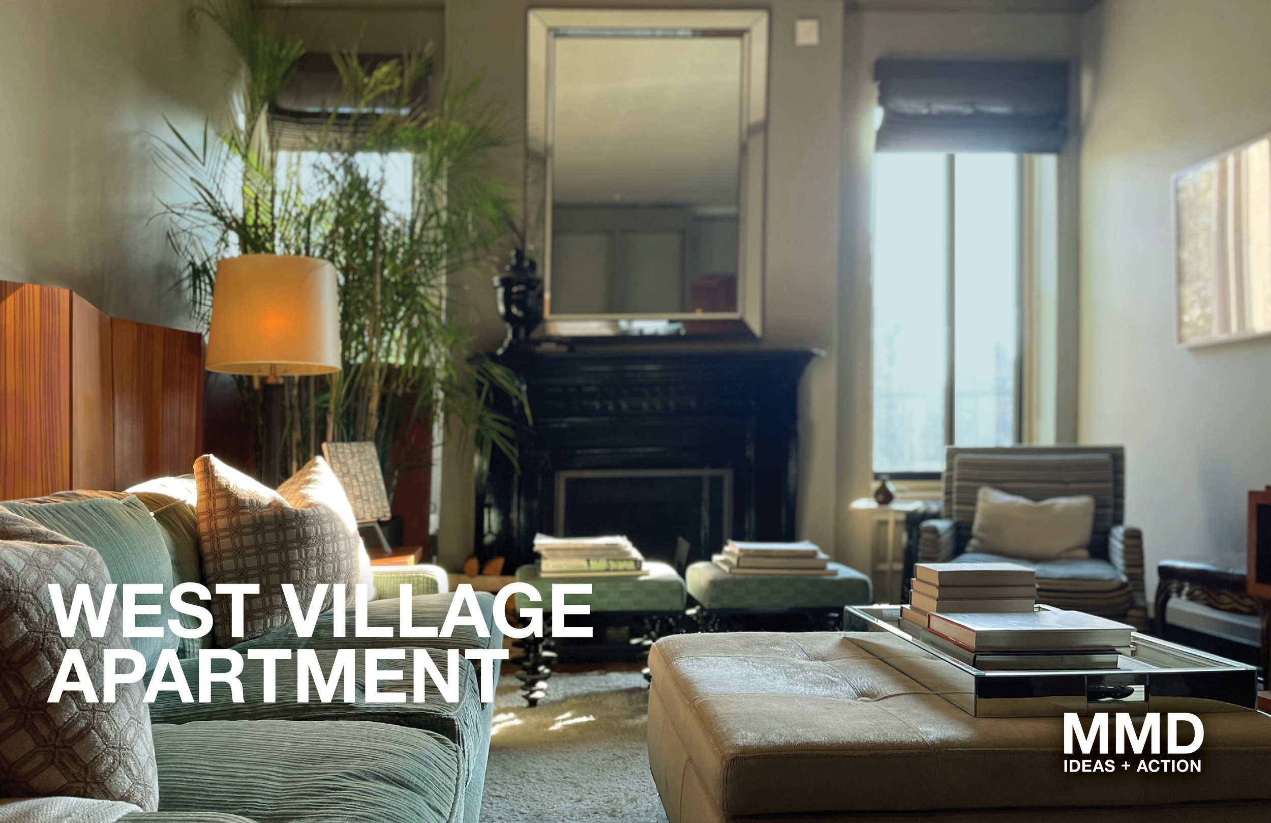 Living room with a sofa, chairs, a coffee table with books, a mirror above a black fireplace, large window with sunlight, and indoor plants.