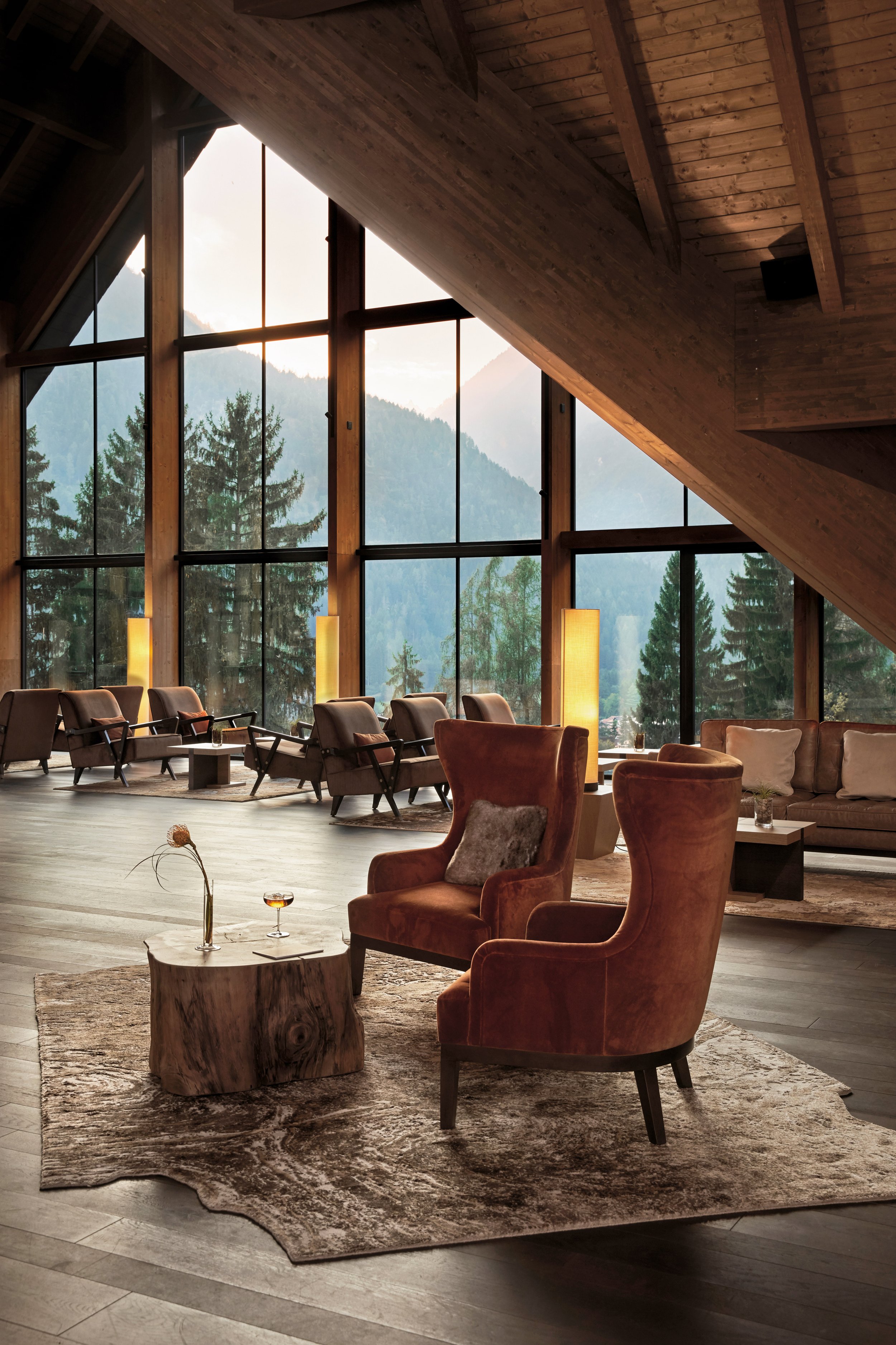 Main lobby of Lefay Resort & Spa Dolomiti with wooden ceiling and panoramic windows