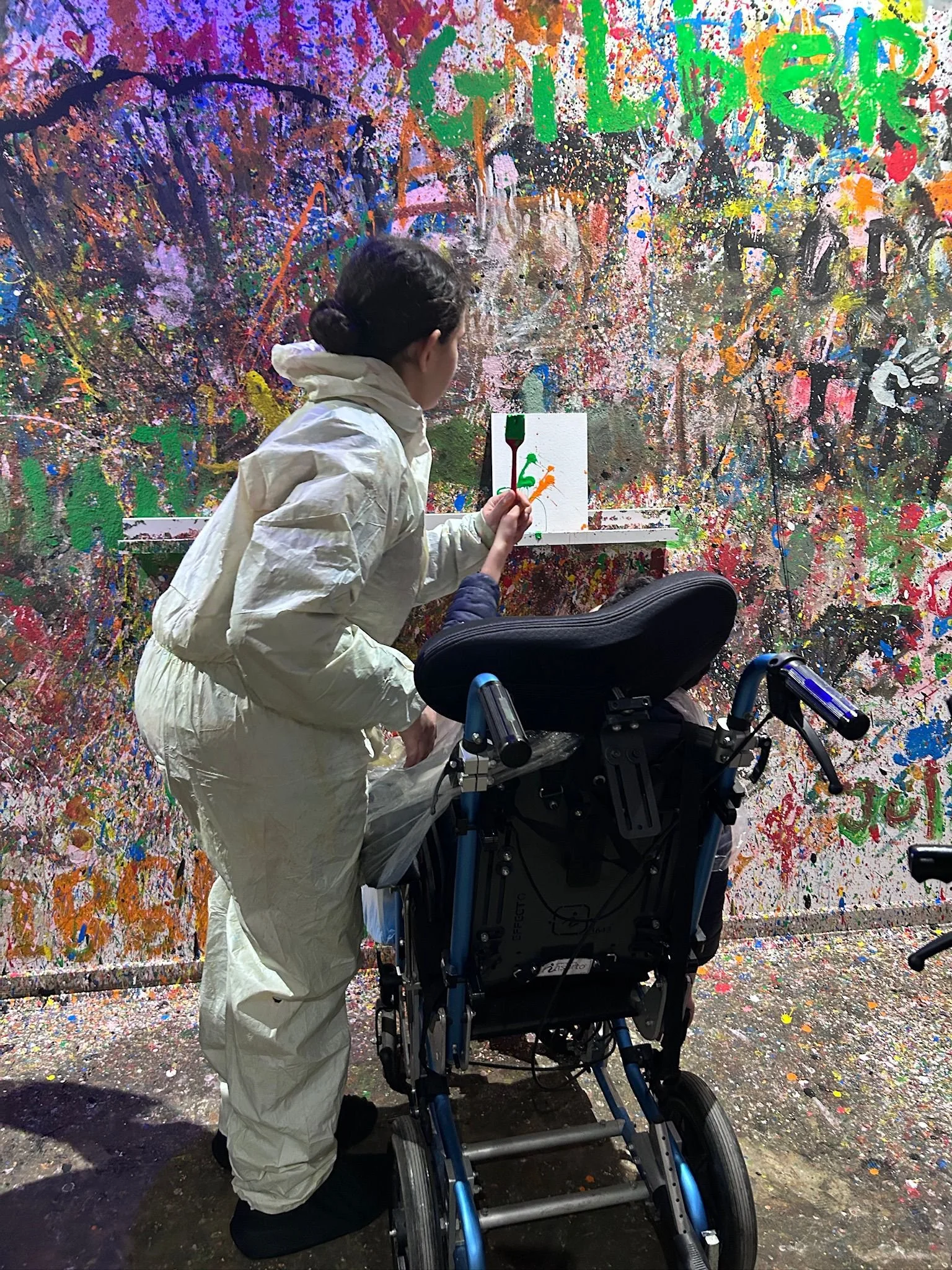 Wheelchair-friendly paint splatting session at SPLAT! in Attard, Malta during a private creative experience.