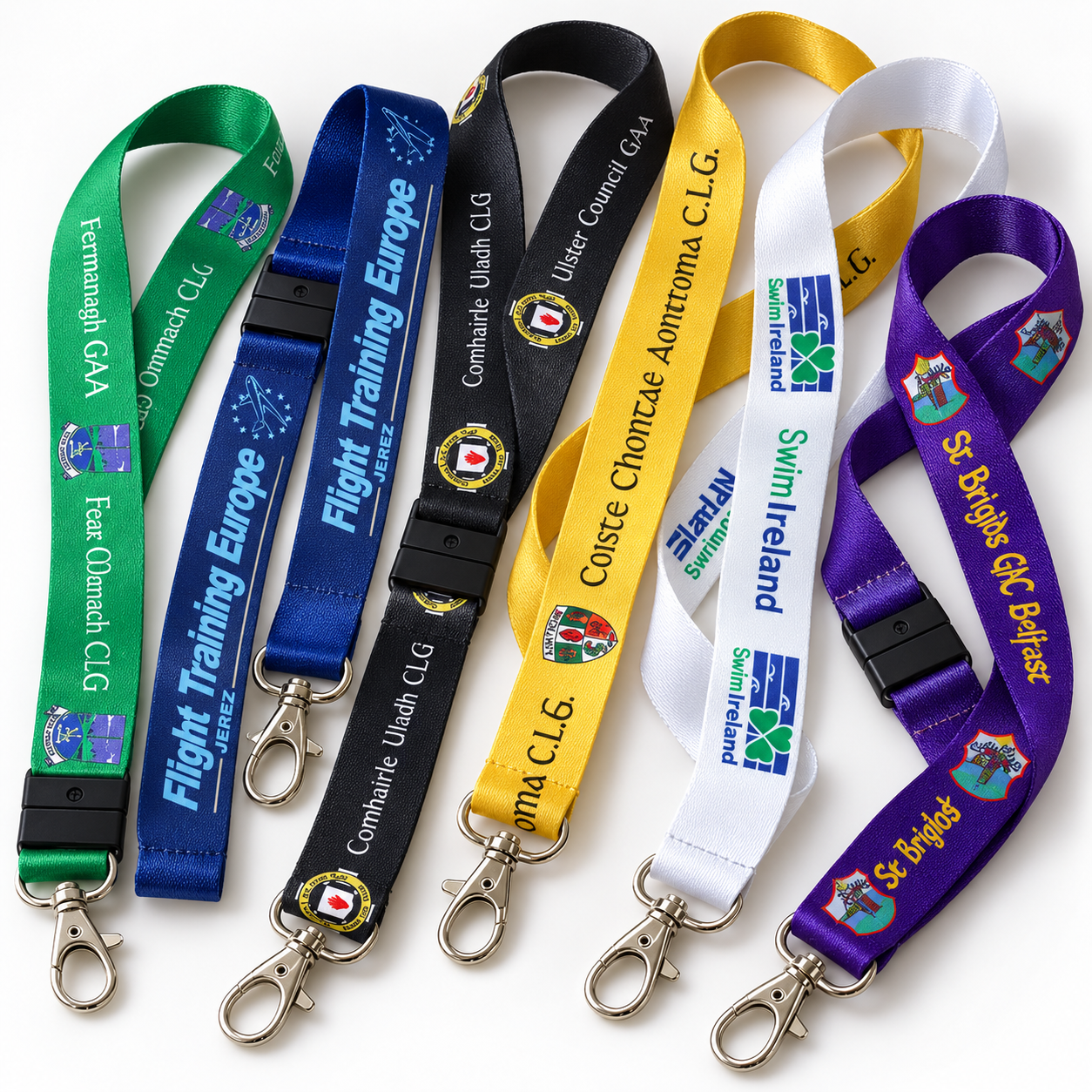 A collection of lanyards in various colours and patterns with clips and name badge holders.