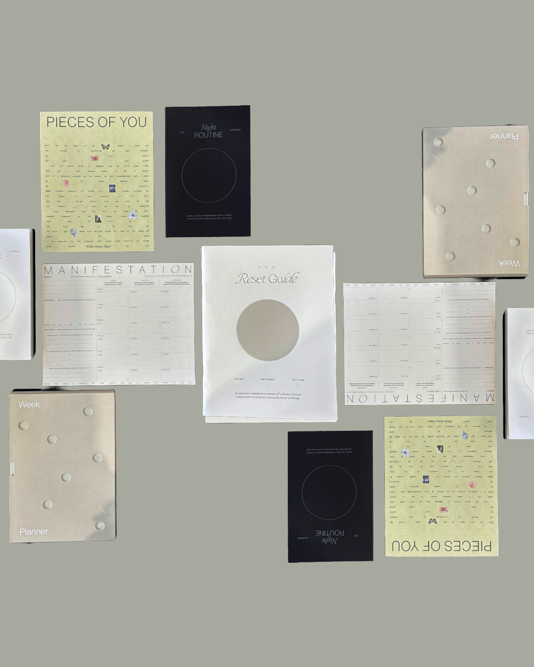 Modern building on grassy hills with snow-capped mountains in the background.