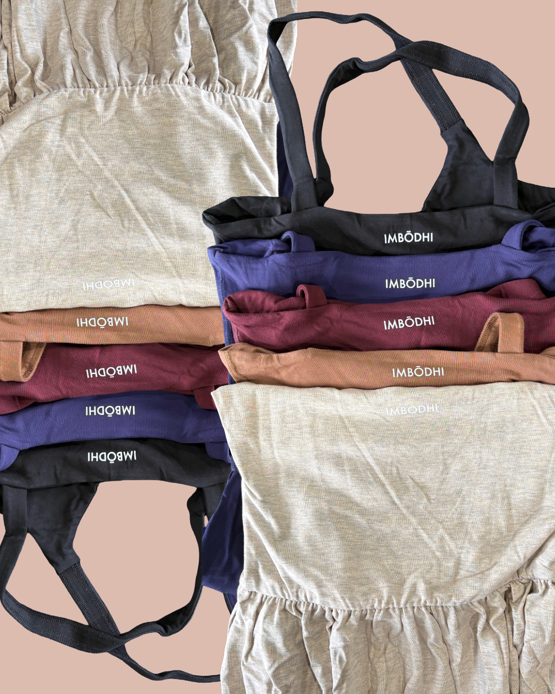 A modern house situated on a green hillside with snow-capped mountains in the background under a cloudy sky.