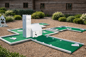 Miniature golf course with a castle-themed obstacle and solvable course layout