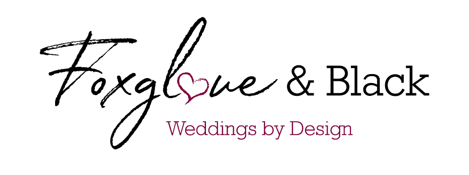 Logo for Foxglove & Black Weddings by Design, featuring stylized text and a heart-shaped design incorporated into the word 'love'