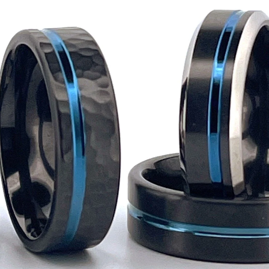 Close-up of a pair of wireless earbuds with black and silver casing and blue accents.