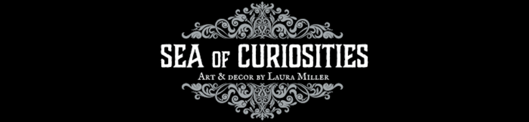 Logo for 'Sea of Curiosities' with decorative black and white design, including the text 'Art & Decor by Laura Miller'.