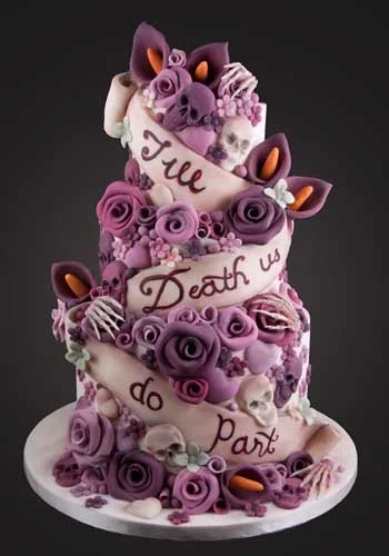 Decorative cake with purple roses, twisted ribbons, and a boa, featuring a pig face and ears, with a message reading 'Till Death Us Do Part' in dark pink script.