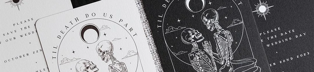 Illustration of two skeletons sitting under a crescent moon with stars, clouds, and mountain scenery in the background, used as part of a Halloween or gothic themed wedding invitation.